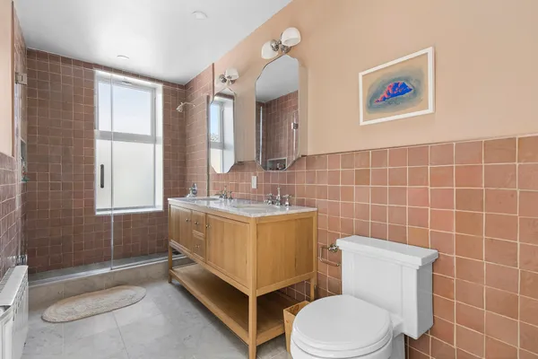 a bathroom with a toilet a sink and bath tub