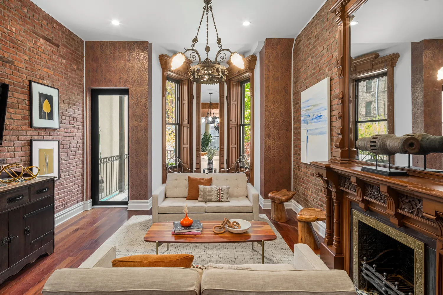 a living room with furniture and large windows