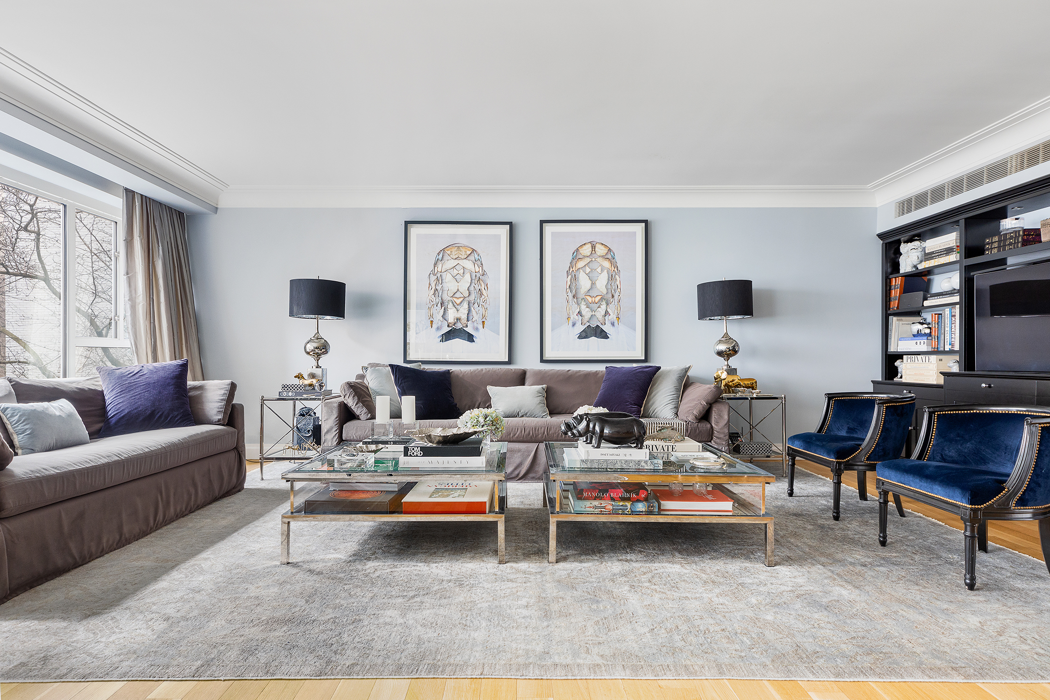 200 East 66th Street, Unit E207 Manhattan, NY 10065 - Photo 2 of 12 a living room with furniture a rug and a window