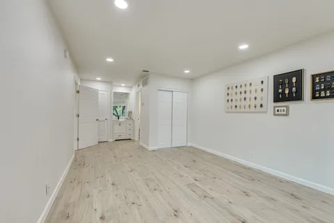 a bathroom with a shower curtain and a sink