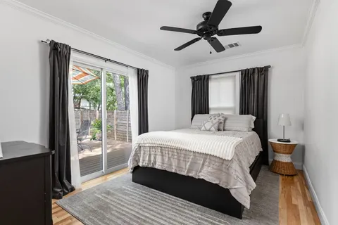 a bedroom with a large bed and a window