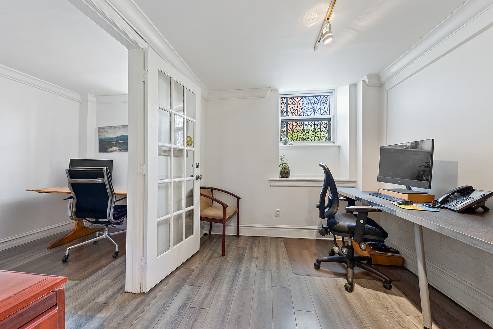 198 6th Avenue Manhattan, NY 10013 - Photo 28 of 45 a view of a workspace with furniture and a window