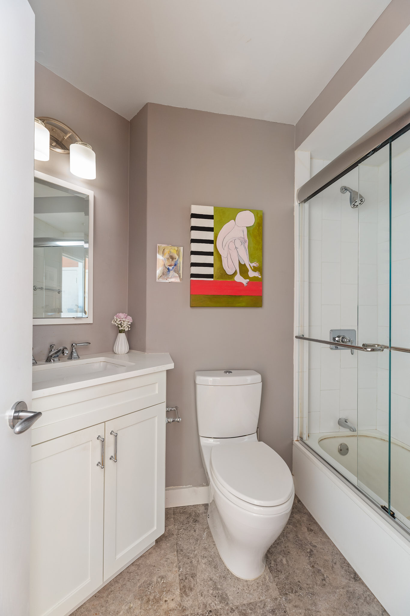 31 Jane Street, Unit 3H Manhattan, NY 10014 - Photo 9 of 14 a bathroom with a toilet a sink and shower