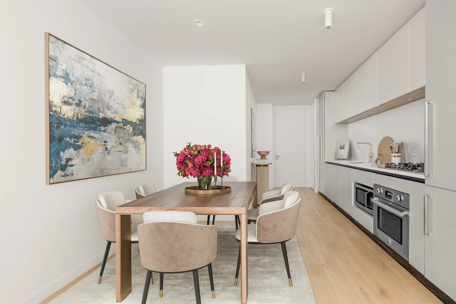 a view of a dining room with furniture and a kitchen
