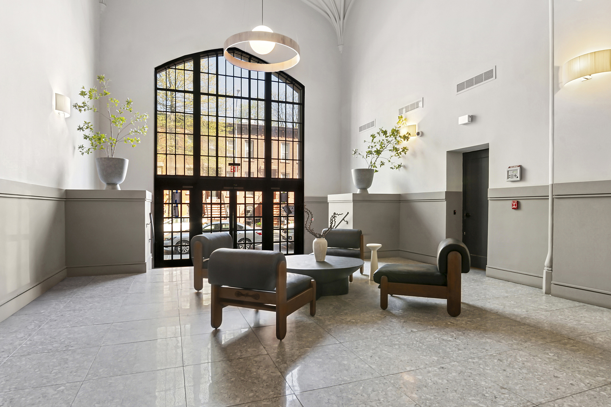 180 Bainbridge Street, Unit 112 Brooklyn, NY 11233 - Photo 25 of 30 a living room with furniture and a window