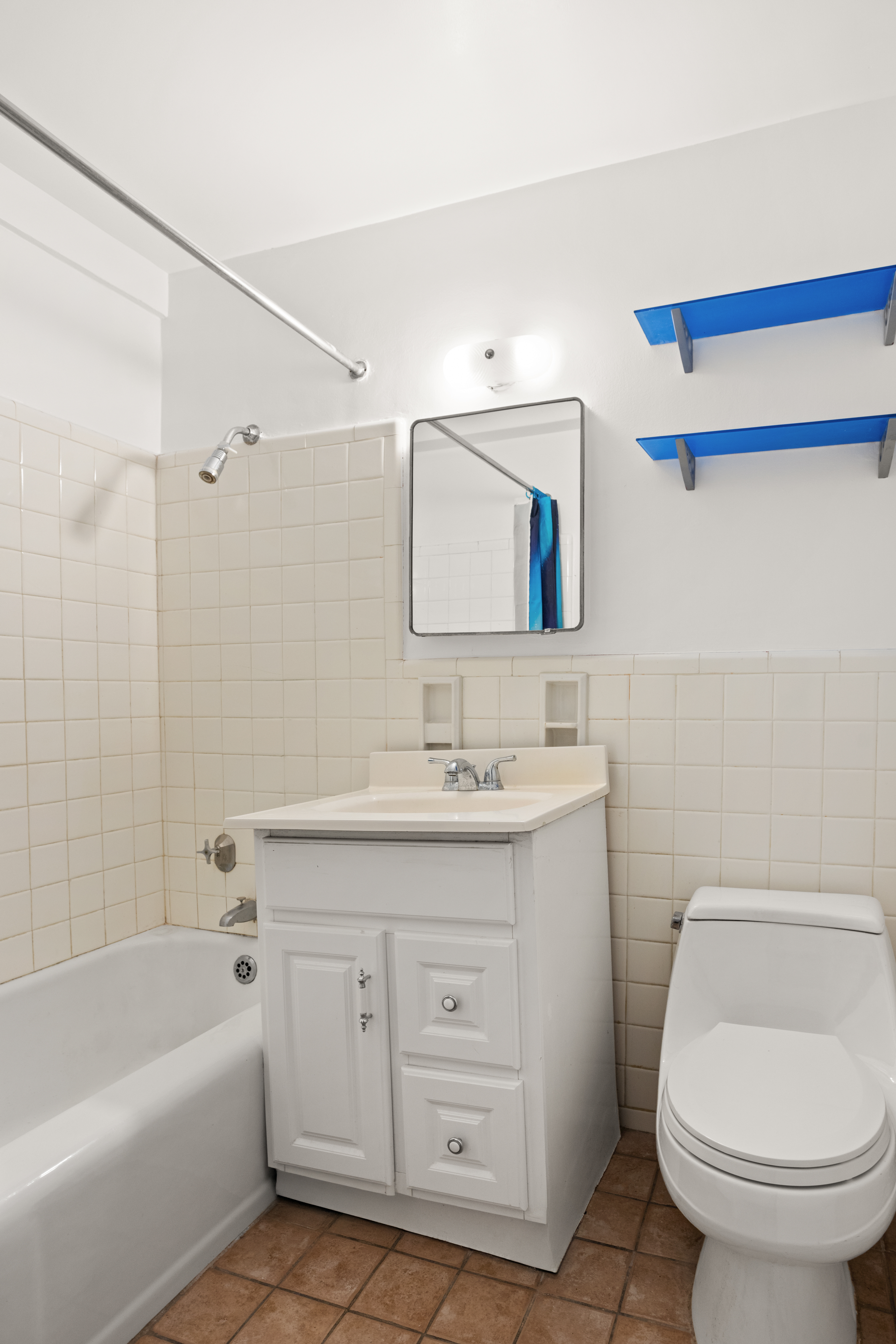 11 Riverside Drive, Unit 9SE Manhattan, NY 10023 - Photo 5 of 13 a bathroom with a granite countertop sink a toilet and shower