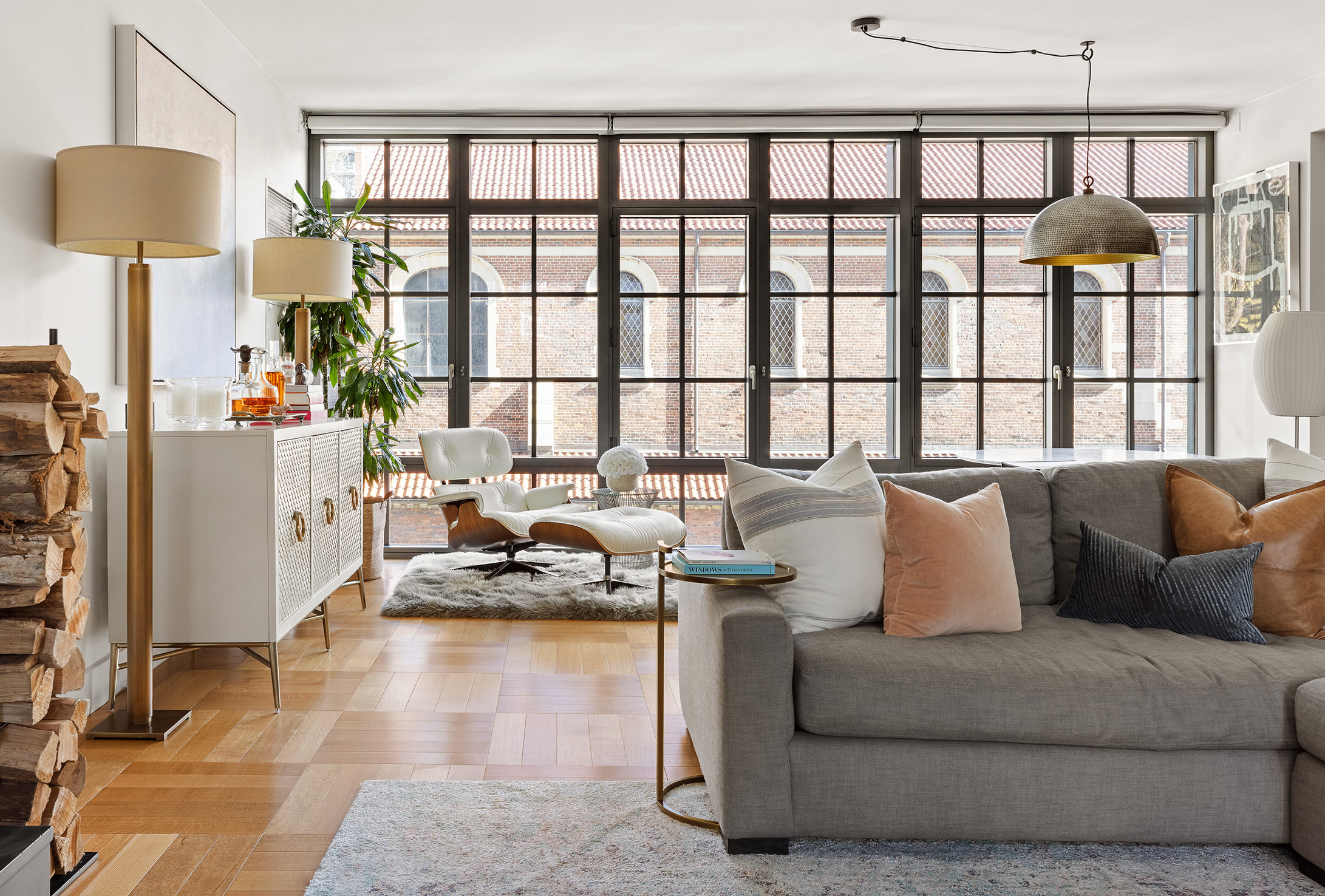 500 West 21st Street, Unit 3A Manhattan, NY 10011 - Photo 2 of 11 a living room with furniture and a large window
