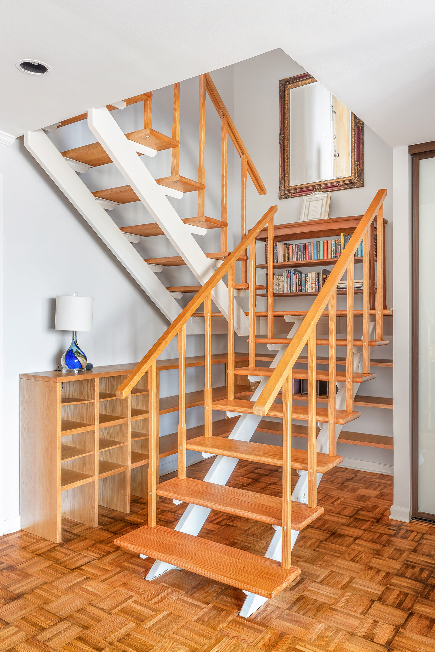 300 East 90th Street, Unit 7C Manhattan, NY 10128 - Photo 4 of 12 a view of entryway with wooden floor and stairs