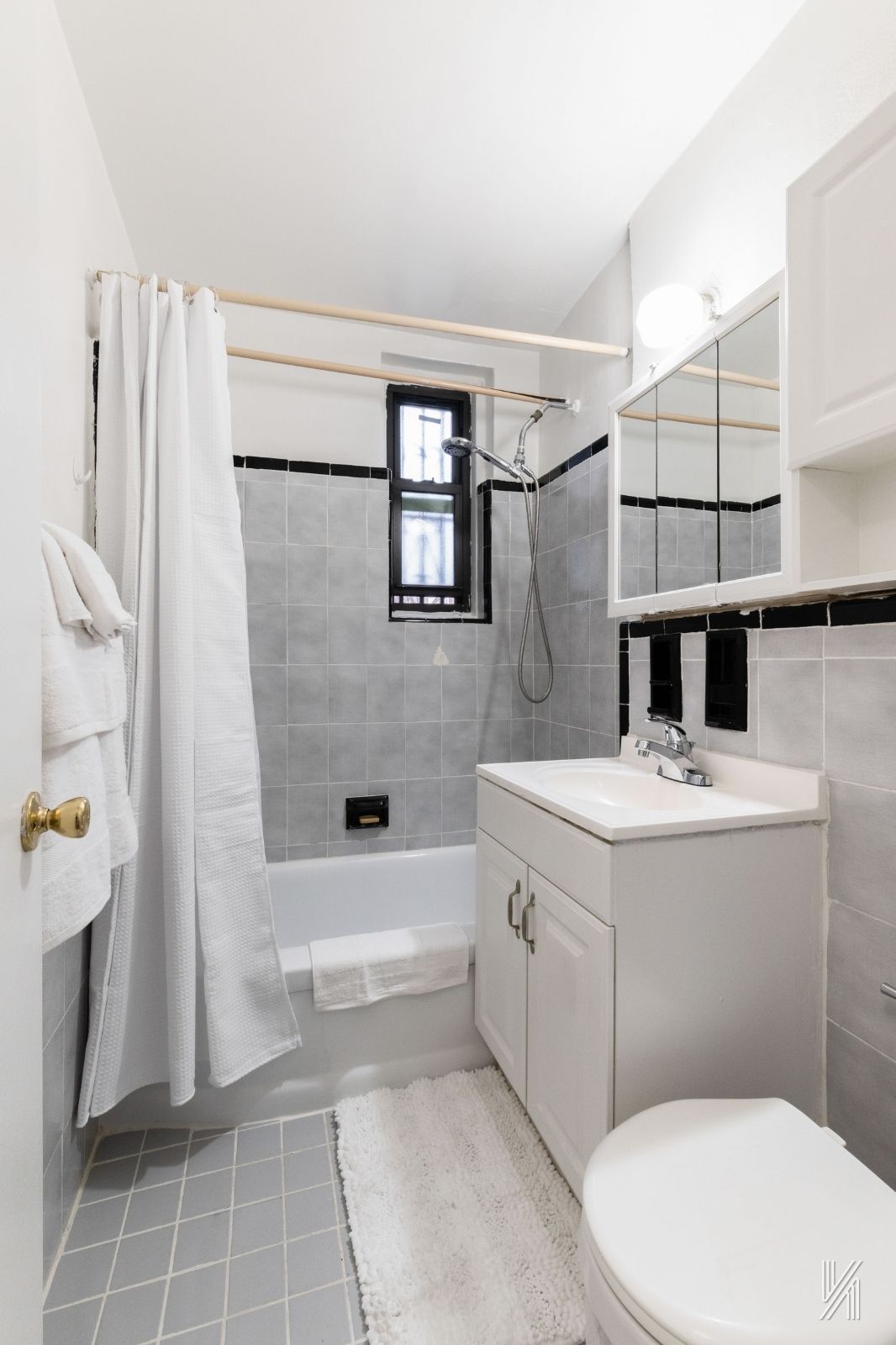 33-24 Junction Boulevard, Unit 1R Queens, NY 11372 - Photo 15 of 17 a bathroom with a sink a toilet and shower