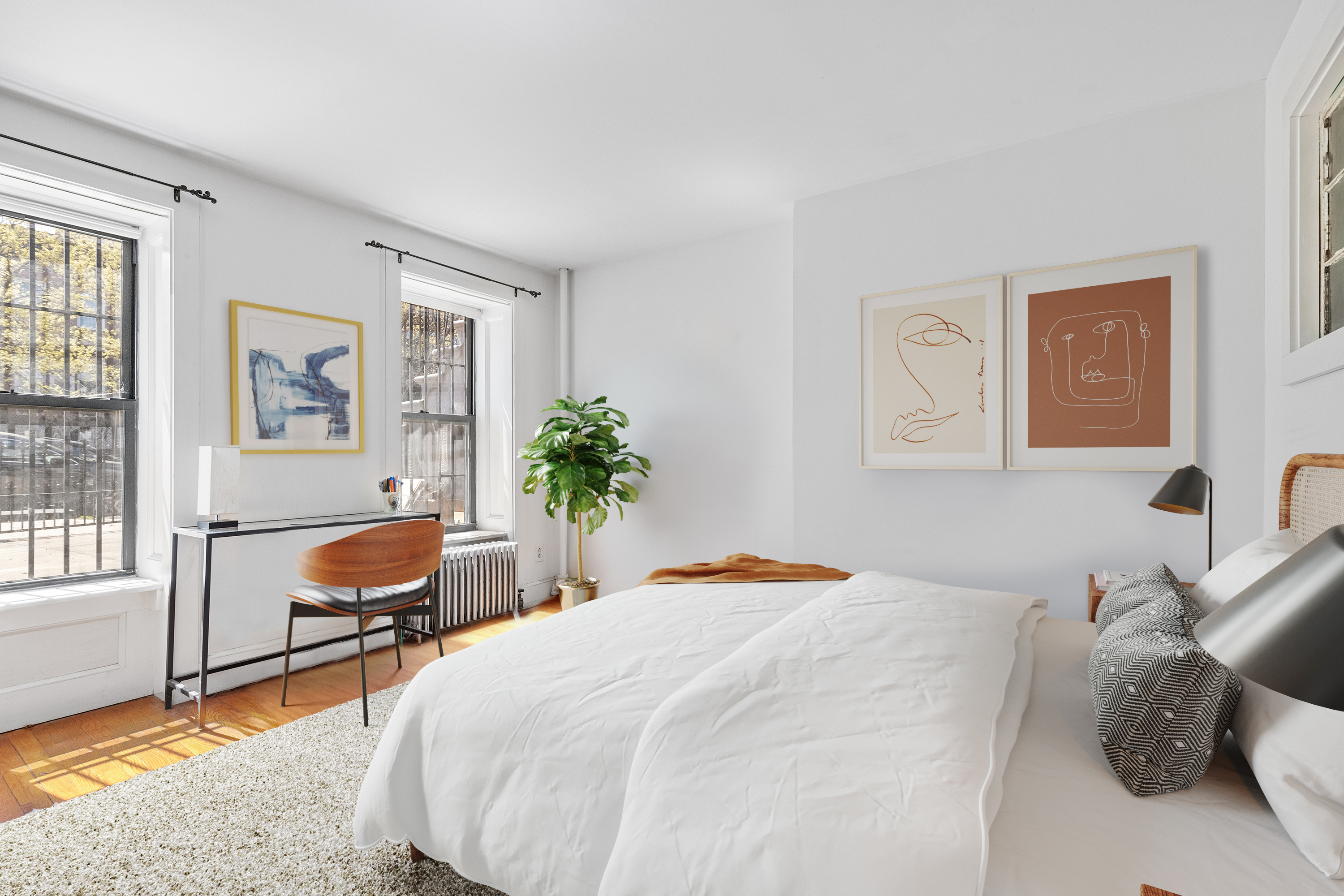 955 Bushwick Avenue Brooklyn, NY 11221 - Photo 12 of 19 a bedroom with a bed and a chair with window