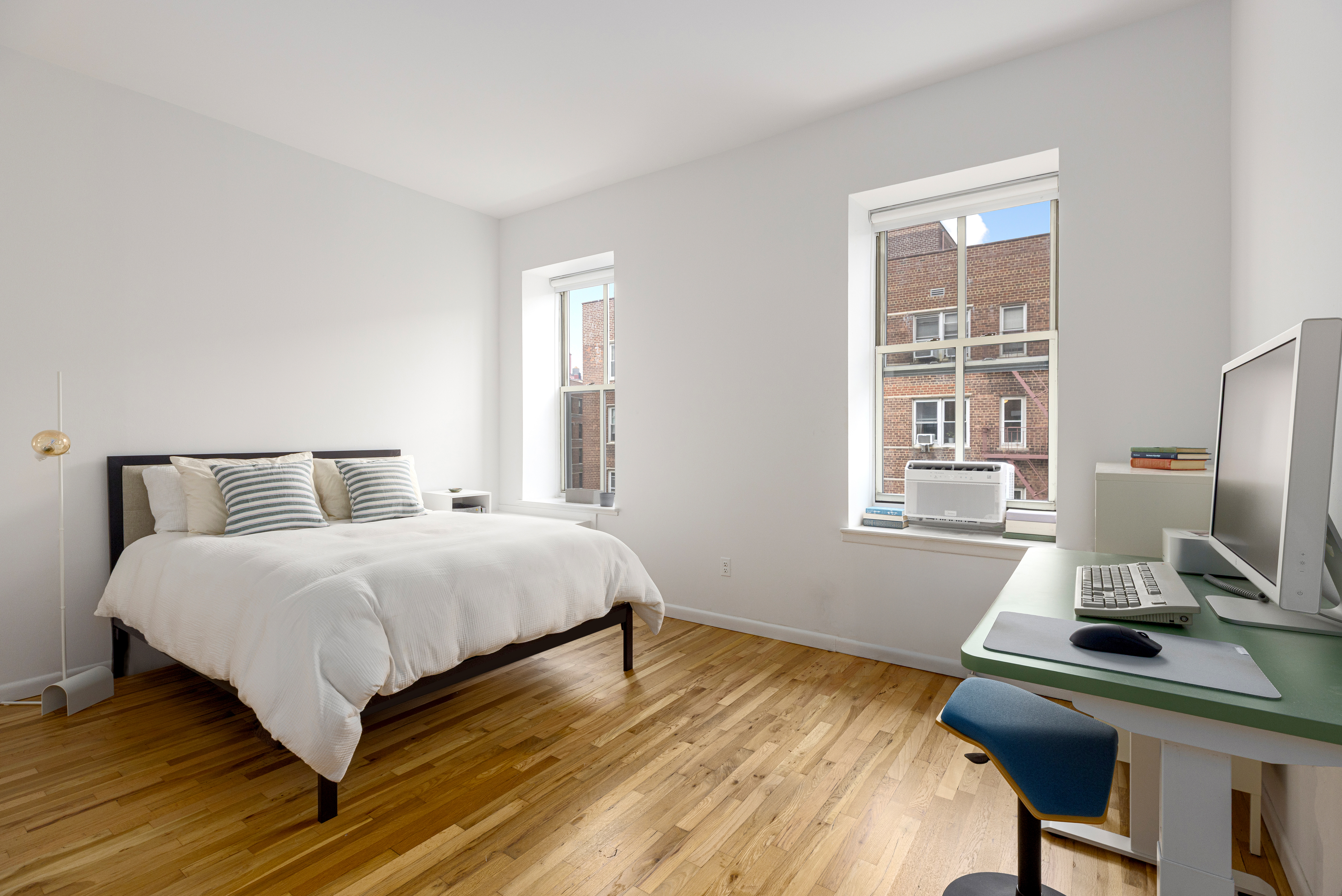 99 Bank Street, Unit 4R Manhattan, NY 10014 - Photo 4 of 15 a bedroom with a bed and a window