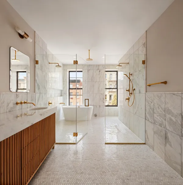 a bathroom with a sink a toilet and bathtub