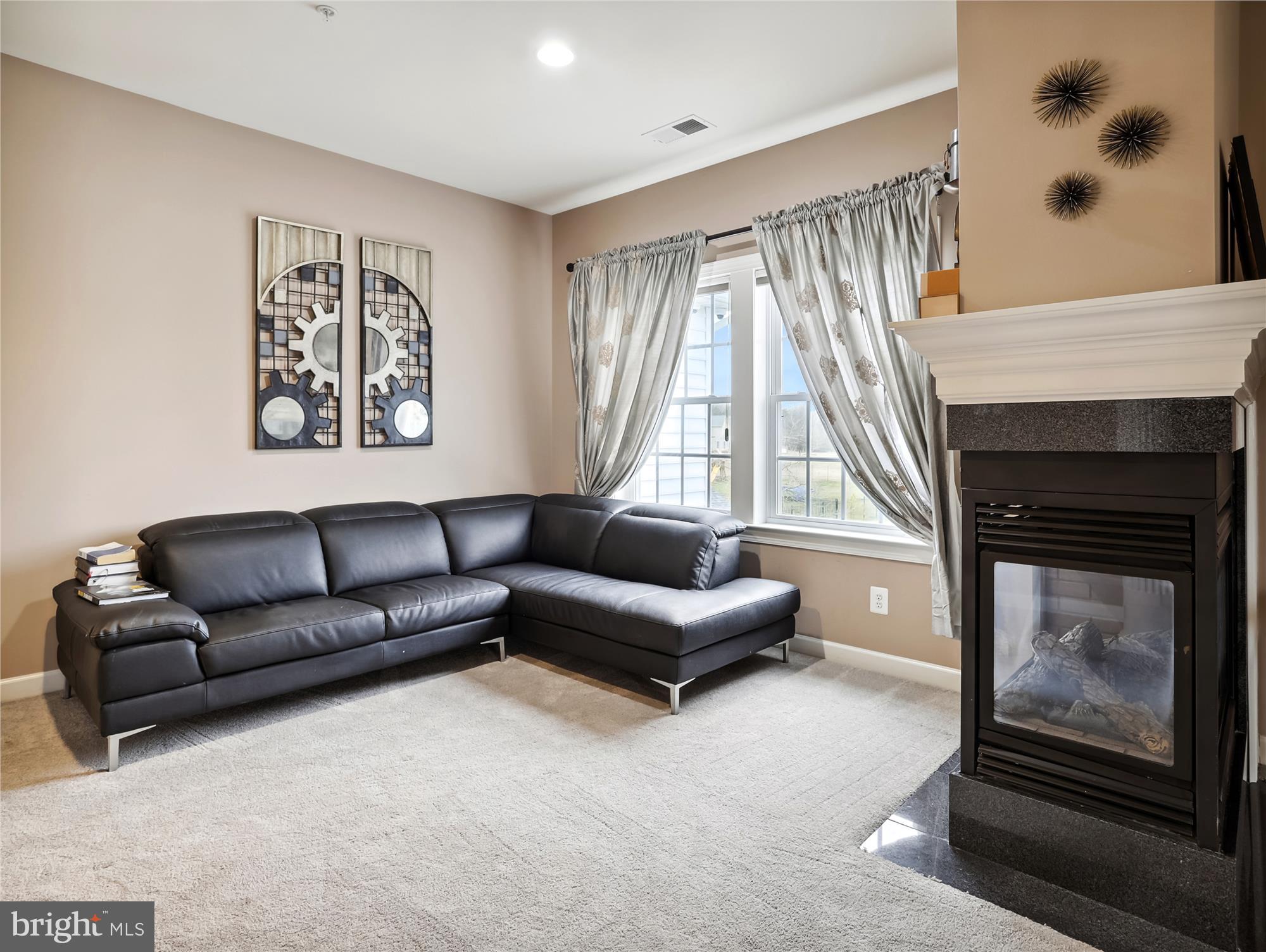 14302 Derby Ridge Road Bowie, MD 20721 - Photo 46 of 67 a living room with furniture and a fireplace