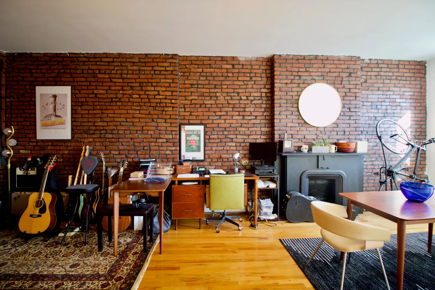 a dining room with furniture and wooden floor