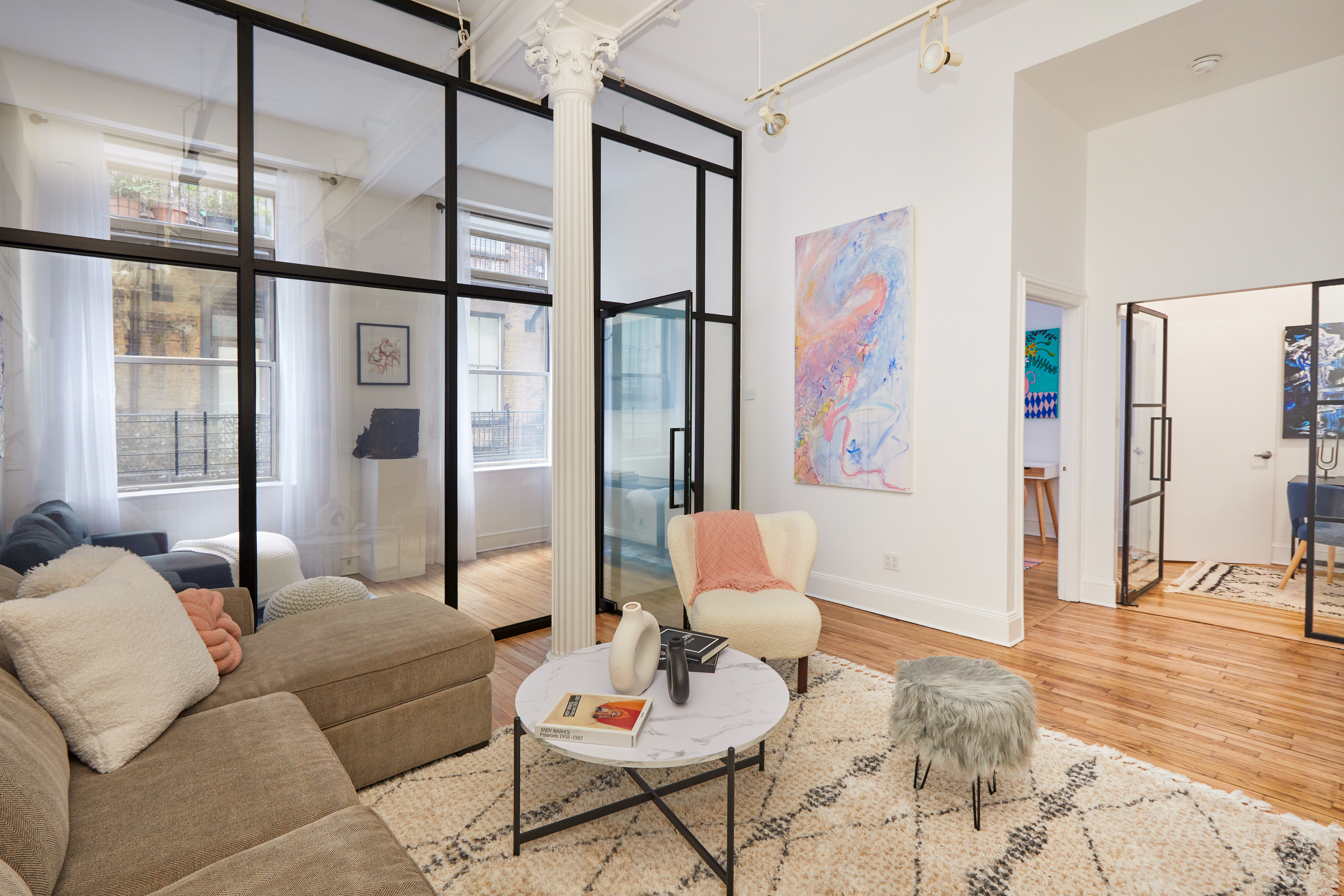 80 Leonard Street, Unit 3G Manhattan, NY 10013 - Photo 9 of 30 a living room with furniture and a window