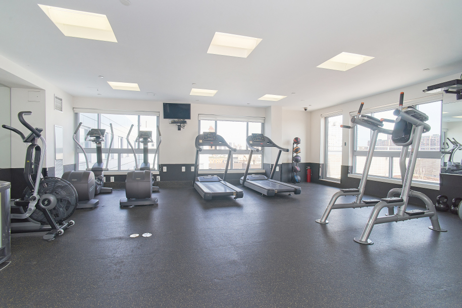 171 West 131st Street, Unit PH3 Manhattan, NY 10027 - Photo 7 of 13 a view of a room with gym equipment