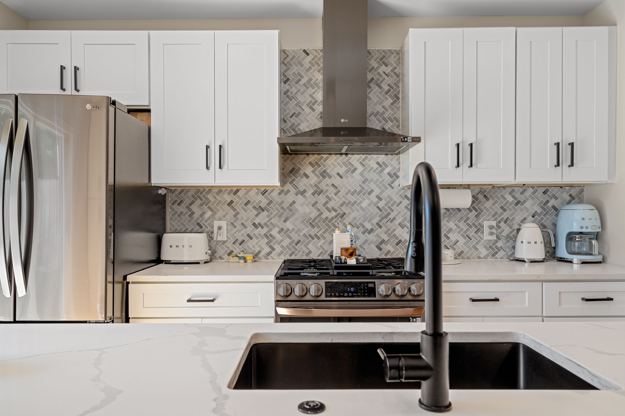 1934 Pemberton Street Philadelphia, PA 19146 - Photo 18 of 50 a kitchen with stainless steel appliances white cabinets and a stove
