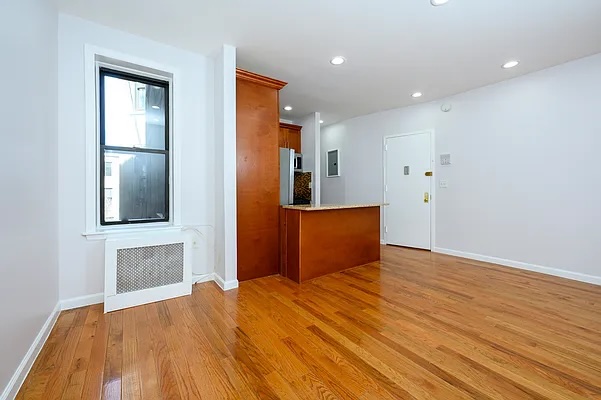 237 West 135th Street, Unit 3A Manhattan, NY 10030 - Photo 5 of 12 a bedroom with a bed and a dresser