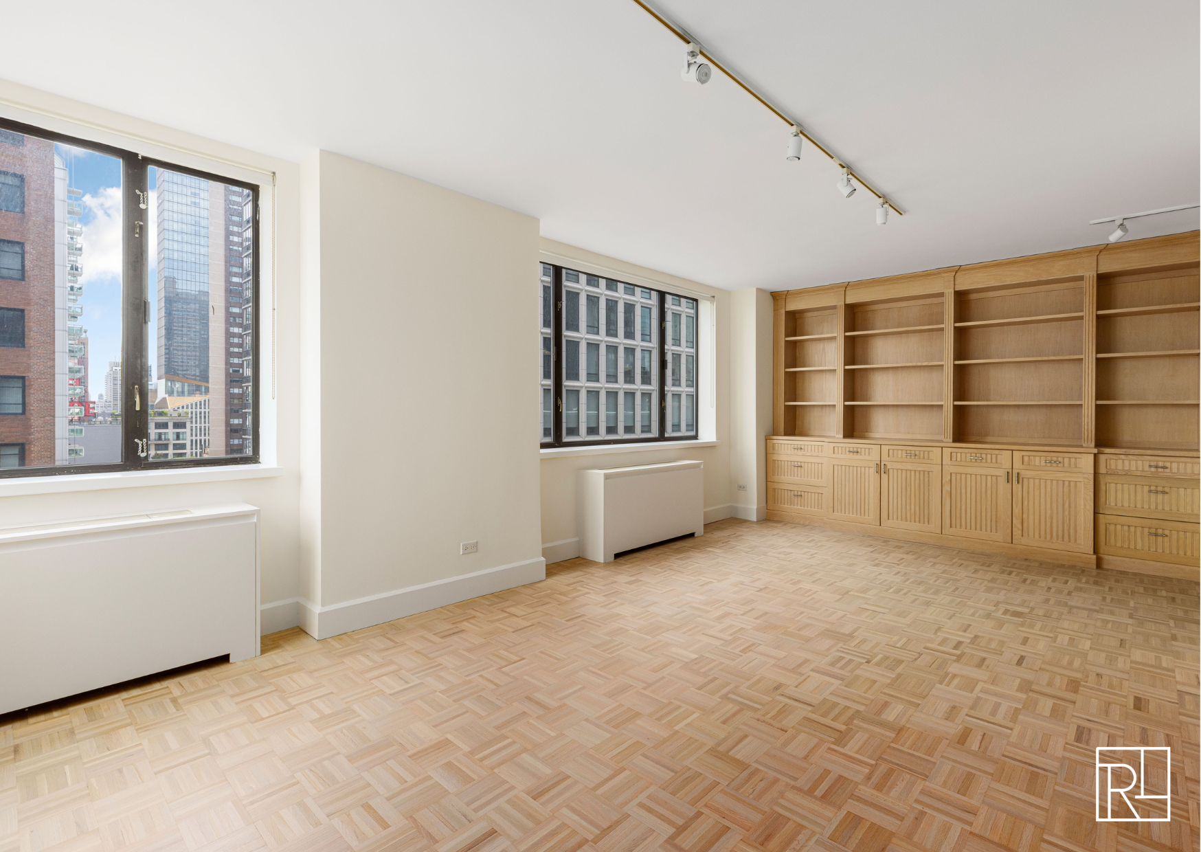 30 West 61st Street, Unit 16D Manhattan, NY 10023 - Photo 3 of 12 an empty room with windows