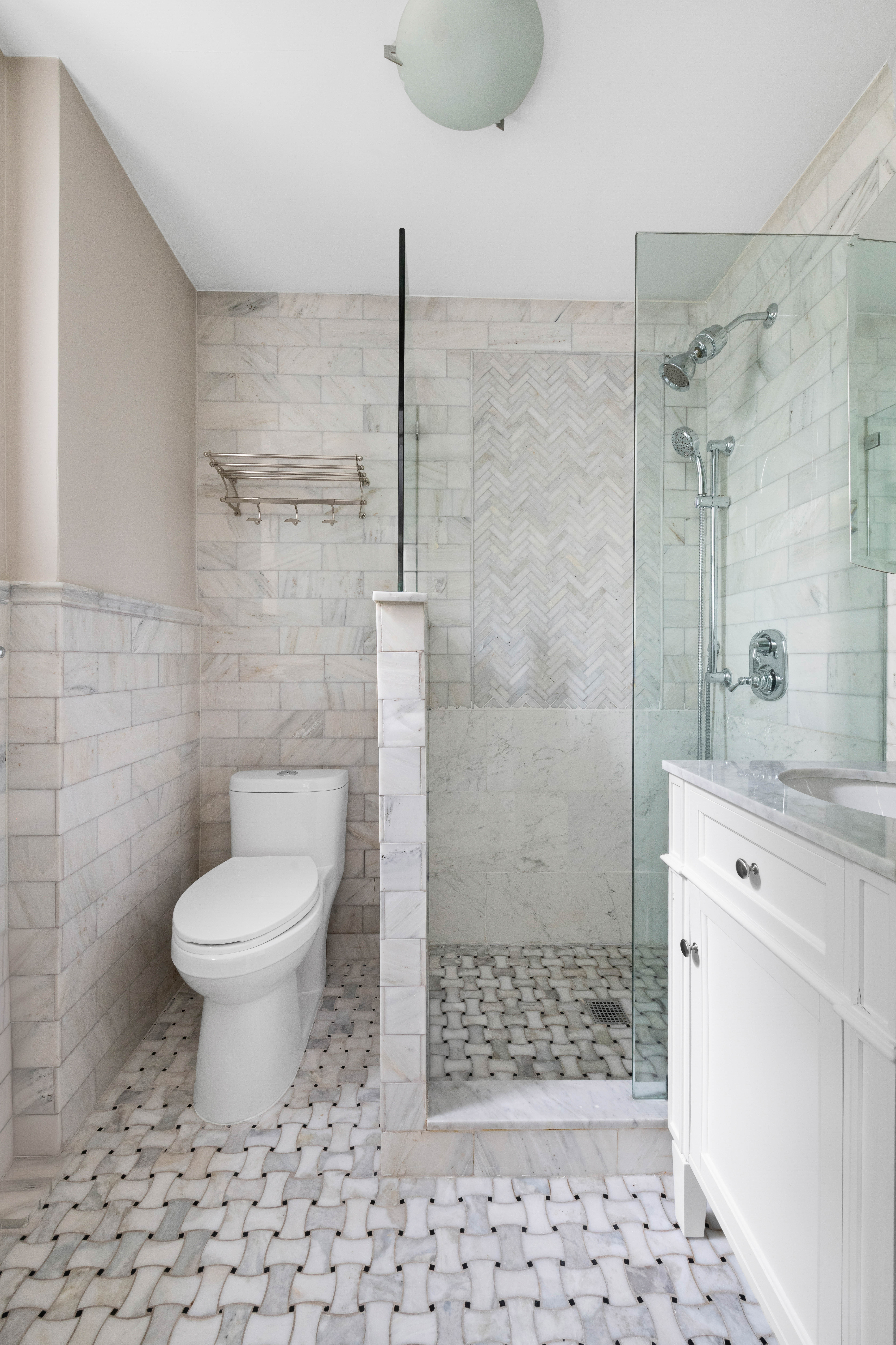 17 West 64th Street, Unit 4E Manhattan, NY 10023 - Photo 5 of 9 a bathroom with a toilet and a shower