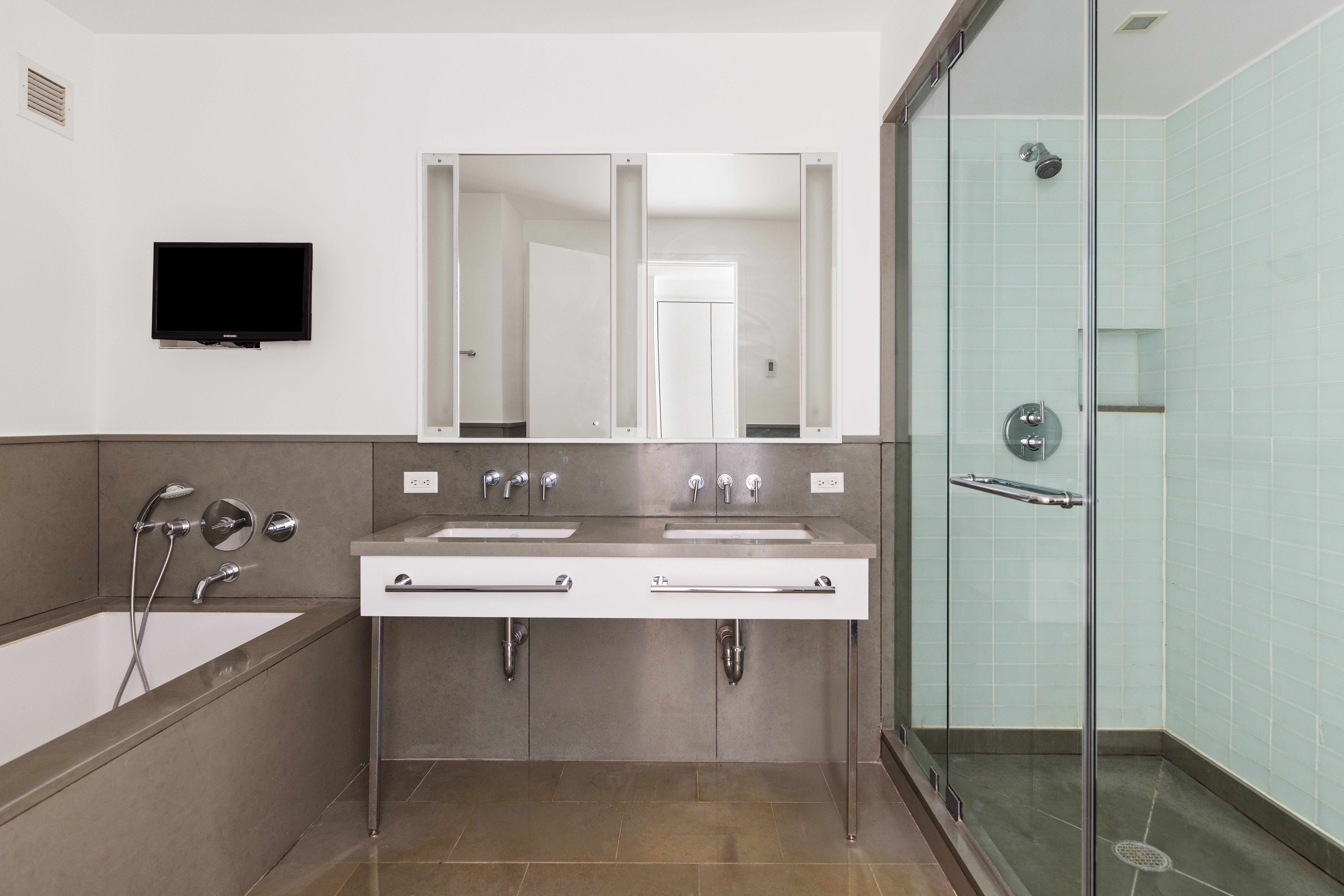 330 Spring Street, Unit 6A Manhattan, NY 10013 - Photo 7 of 11 a bathroom with a sink and a mirror