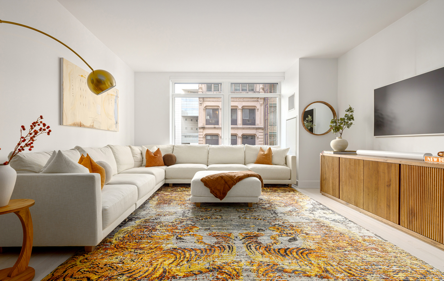 a living room with furniture and a flat screen tv