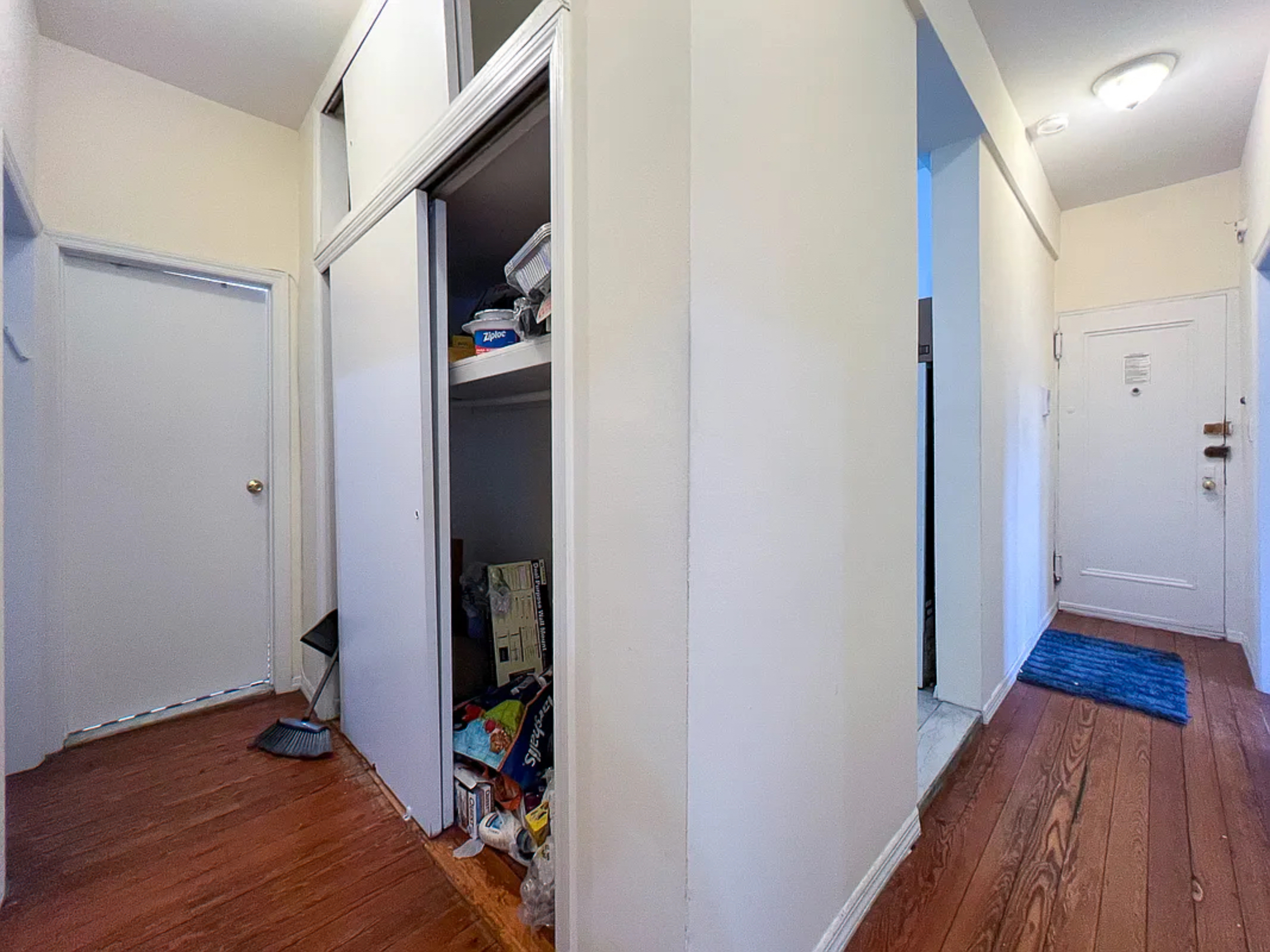 55 East 2nd Street, Unit 7 Manhattan, NY 10003 - Photo 7 of 18 a view of a hallway with wooden floor and closet