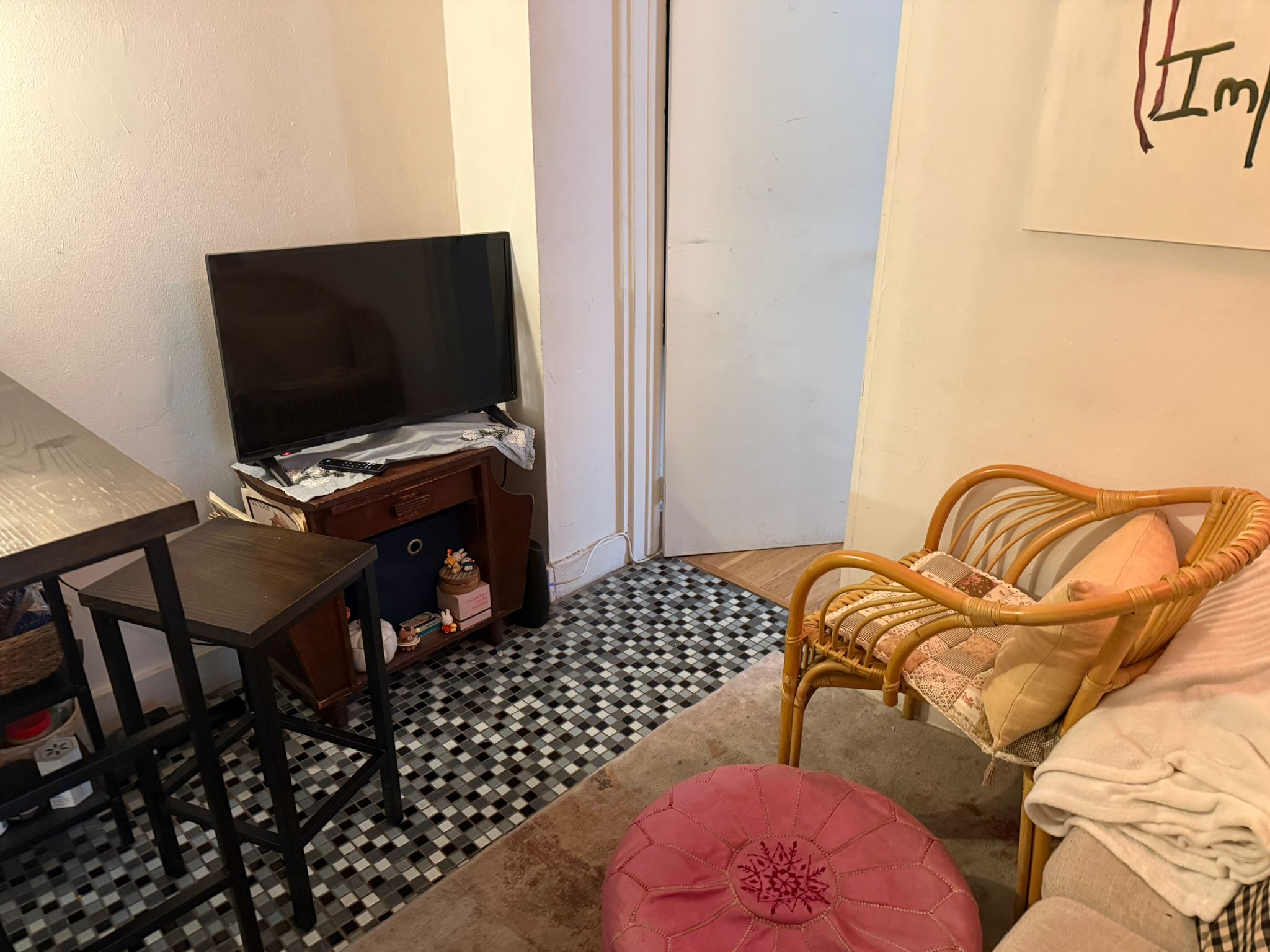 1278 1st Avenue, Unit 2 Manhattan, NY 10065 - Photo 5 of 19 a bedroom with a bed and a flat screen tv