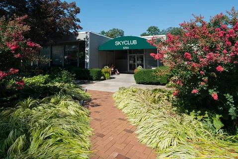 a view of a house with a flower garden