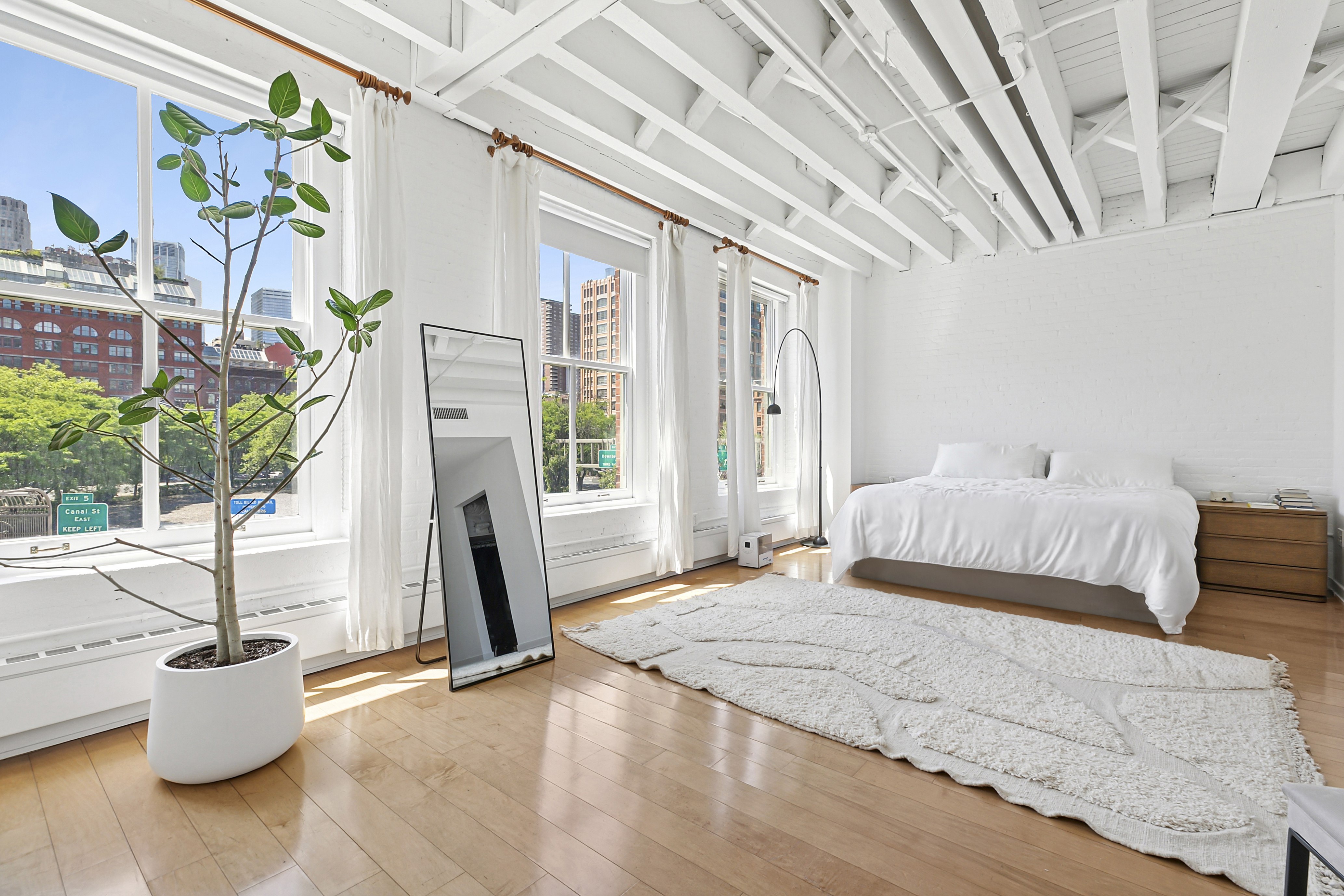 28 Laight Street, Unit 3B Manhattan, NY 10013 - Photo 3 of 11 a bedroom with furniture and a window