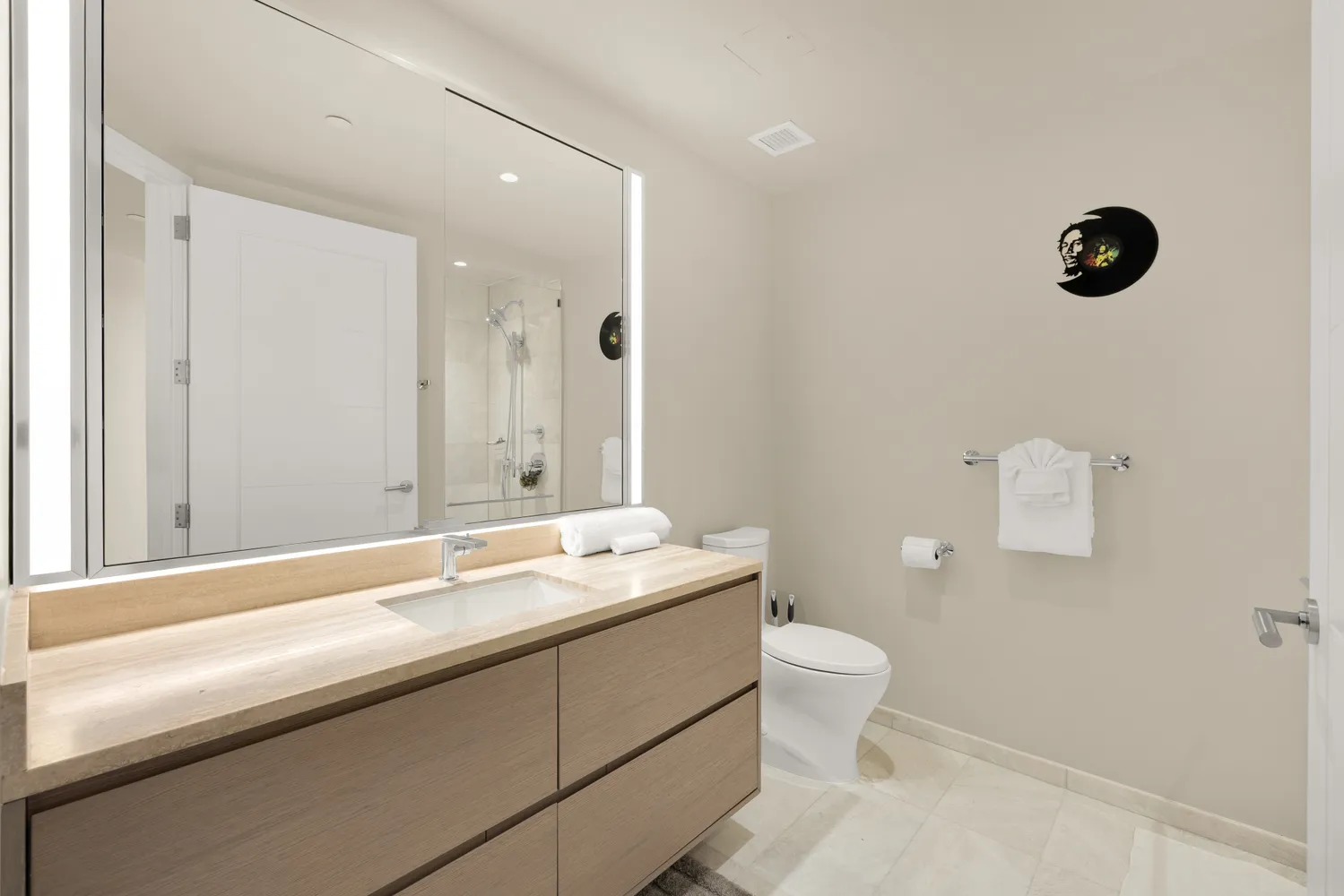 a living room with furniture and view of kitchen