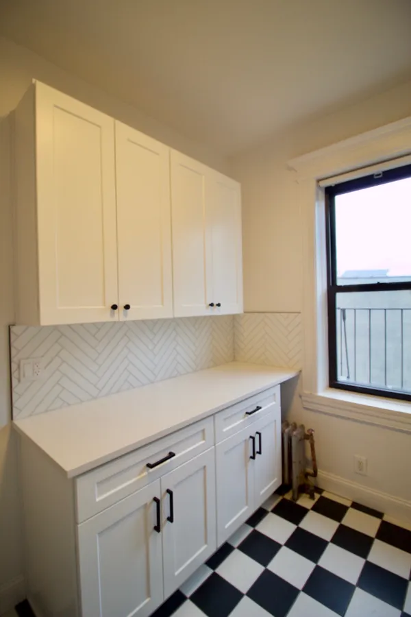 a kitchen with a sink and cabinets