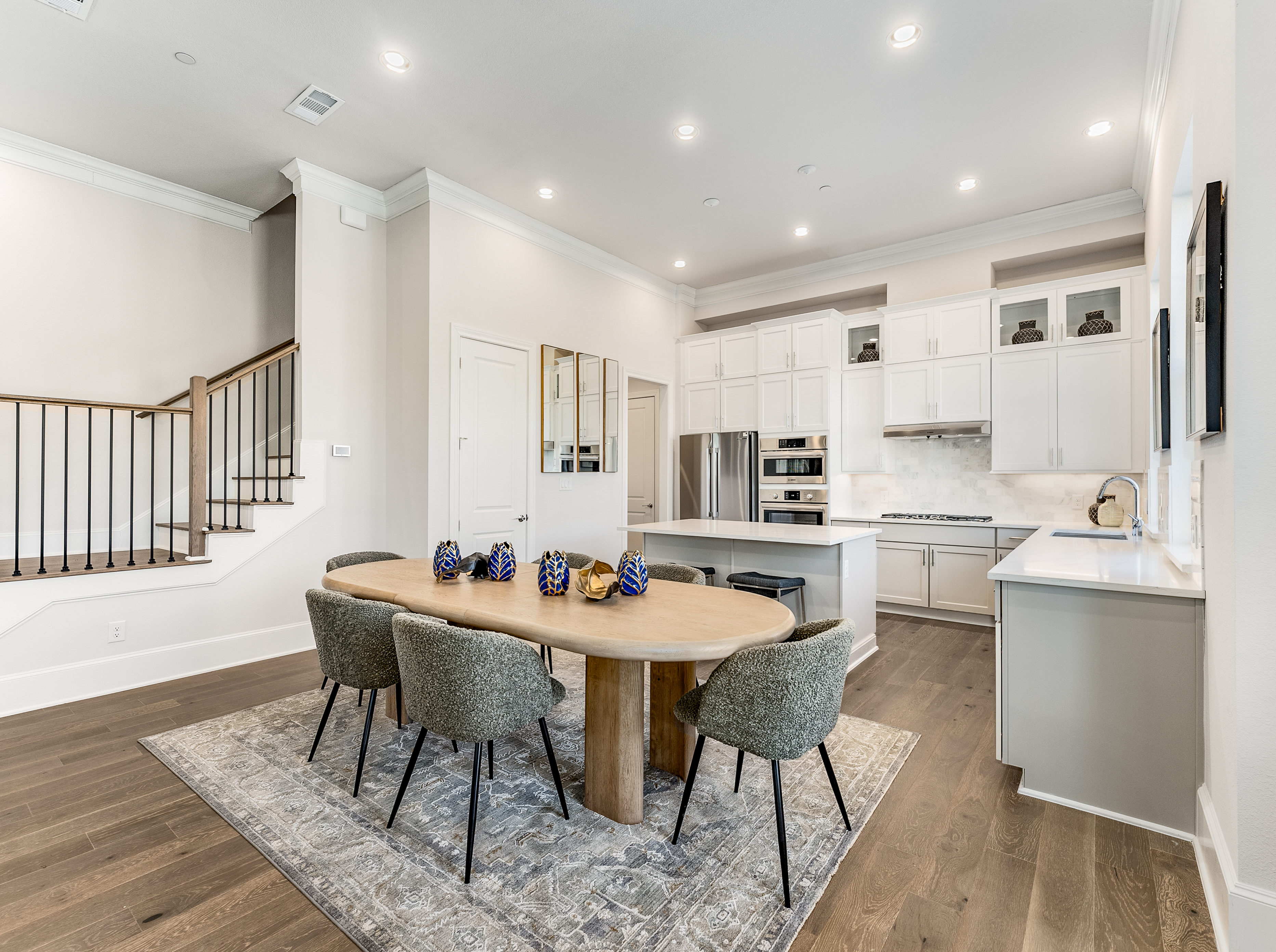 1408 N Avenue Plano, TX 75074 - Photo 6 of 13 a kitchen with stainless steel appliances kitchen island granite countertop a sink and cabinets
