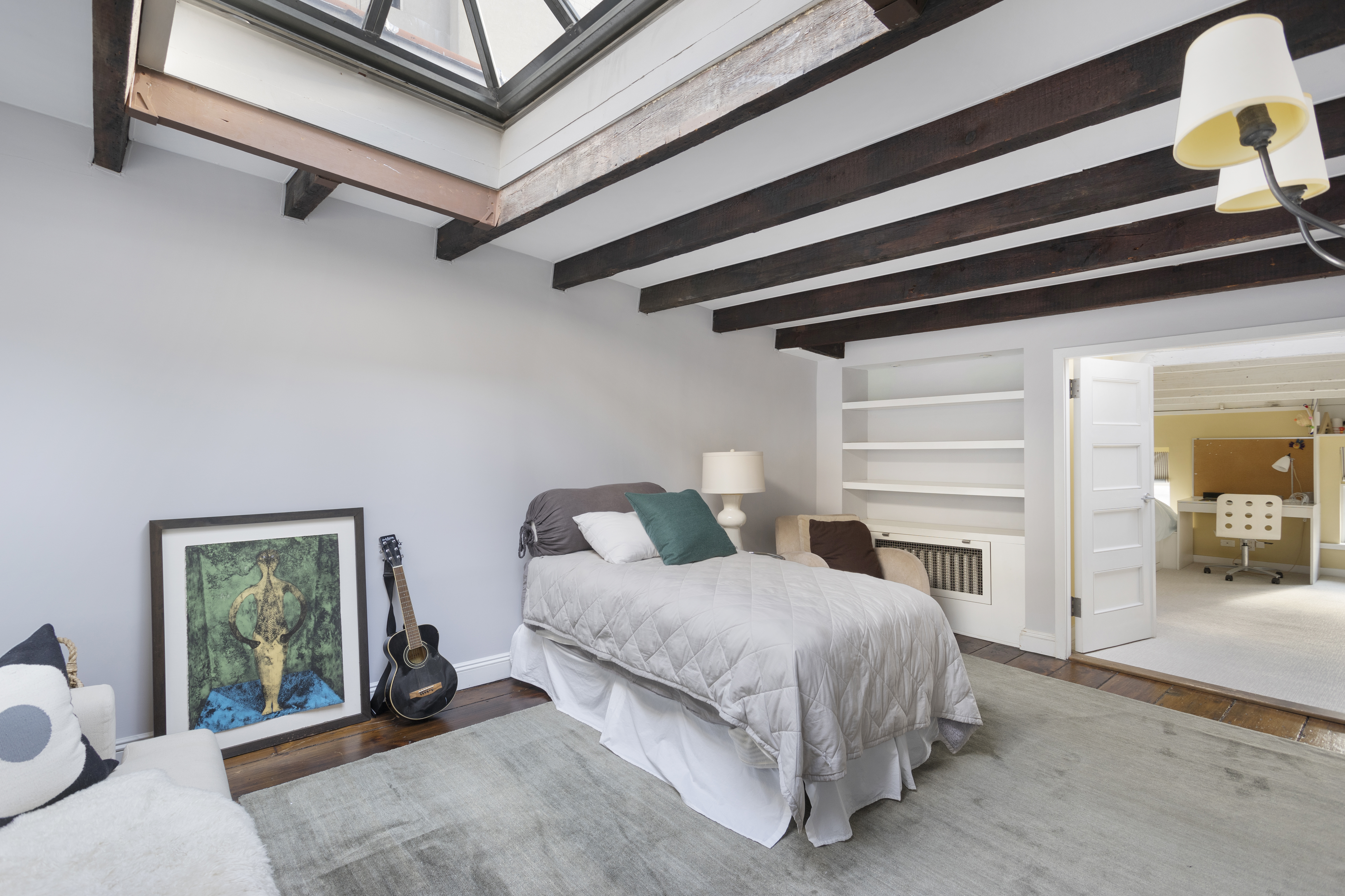 75 Washington Place, Unit TRIPLEX Manhattan, NY 10011 - Photo 10 of 14 a bedroom with a bed and a window