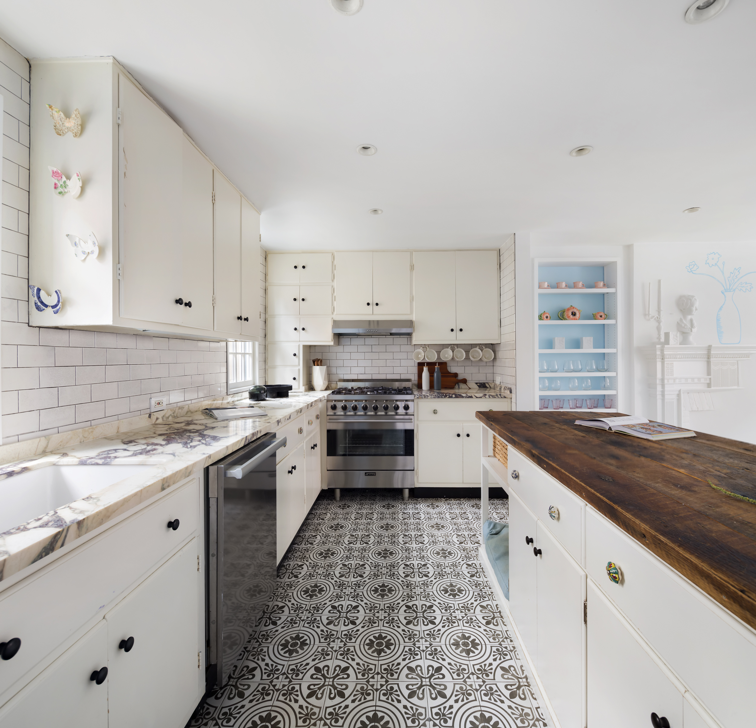 49 Barrow Street Manhattan, NY 10014 - Photo 8 of 25 a kitchen with granite countertop a stove sink and cabinets
