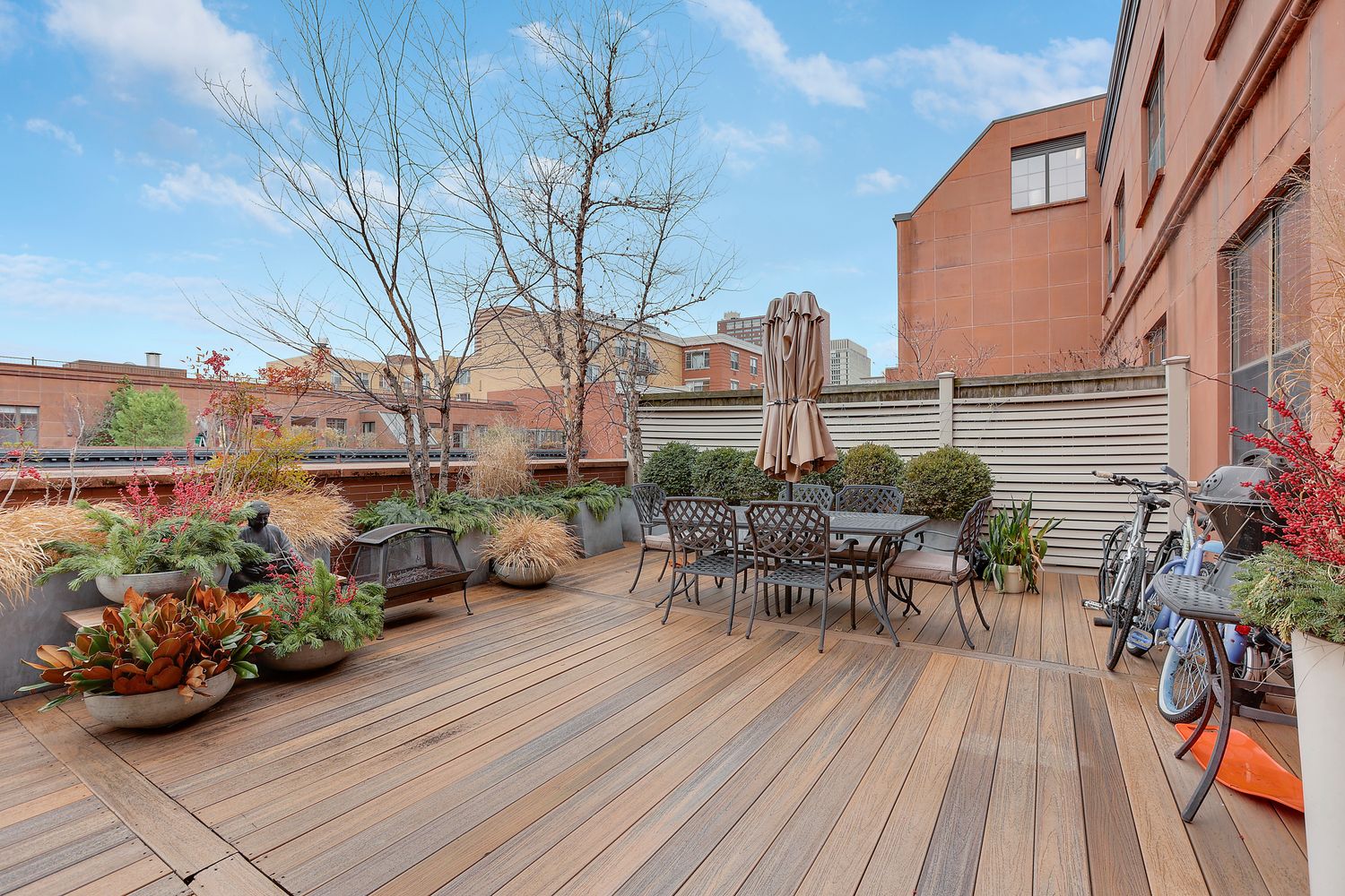 a view of a chairs and table on the wooden deck