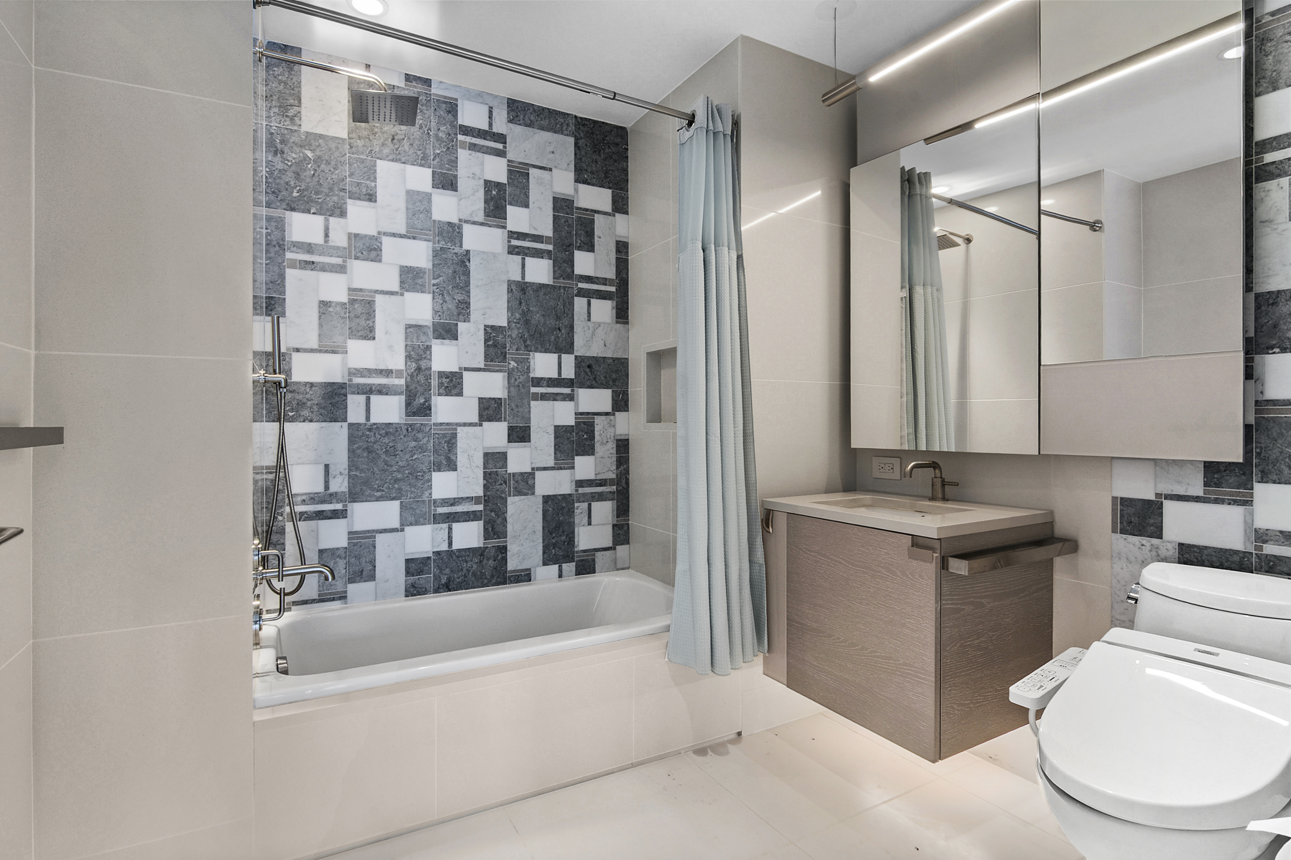 1 City Point, Unit 57A Brooklyn, NY 11201 - Photo 7 of 23 a bathroom with a granite countertop sink a toilet and shower