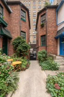 a view of backyard of house and car parked