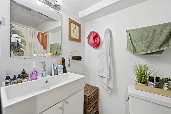a kitchen with a sink and a refrigerator