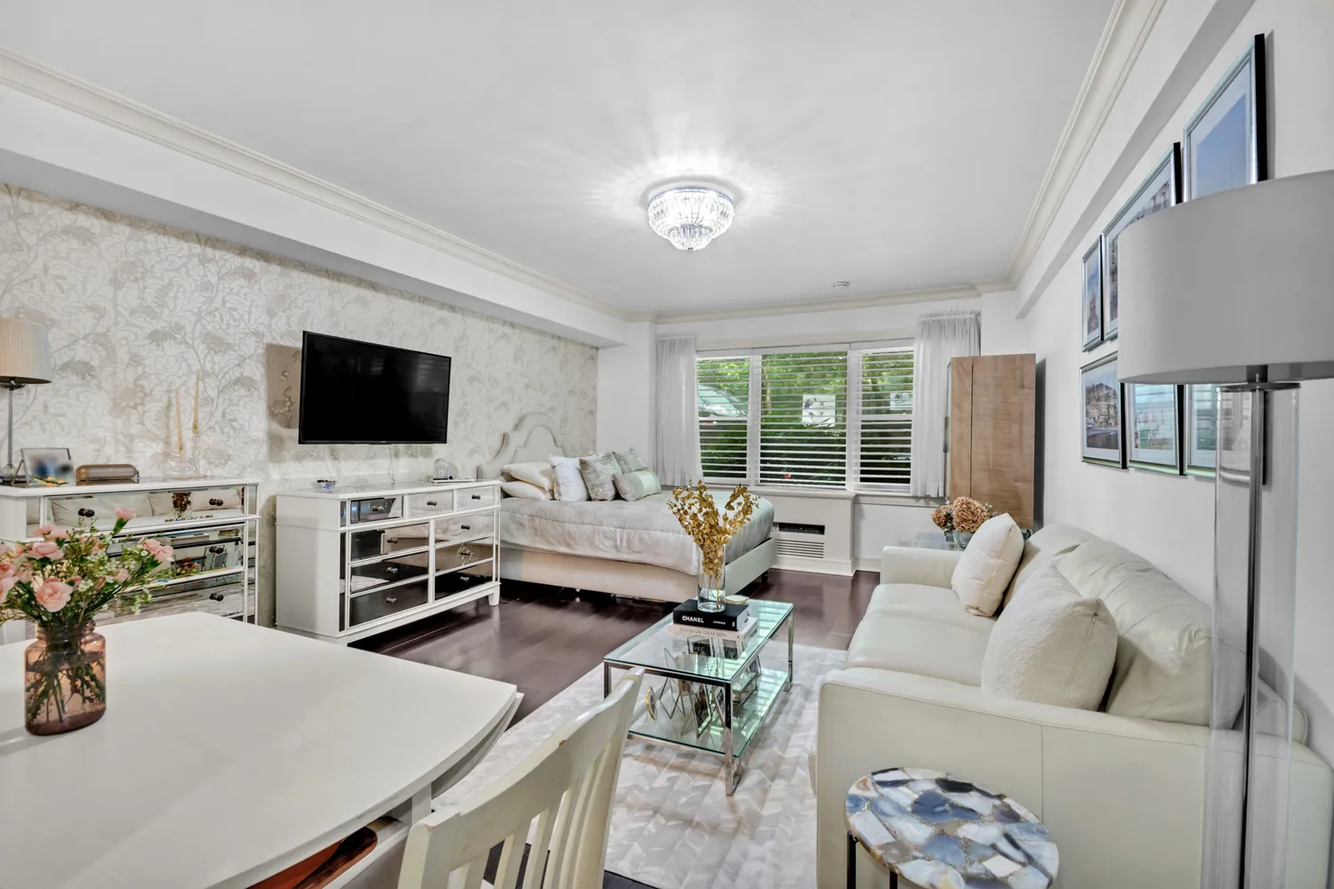 a living room with furniture and a flat screen tv