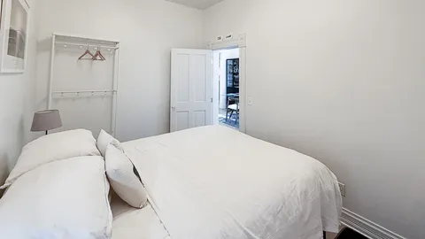 a bedroom with a bed and a closet