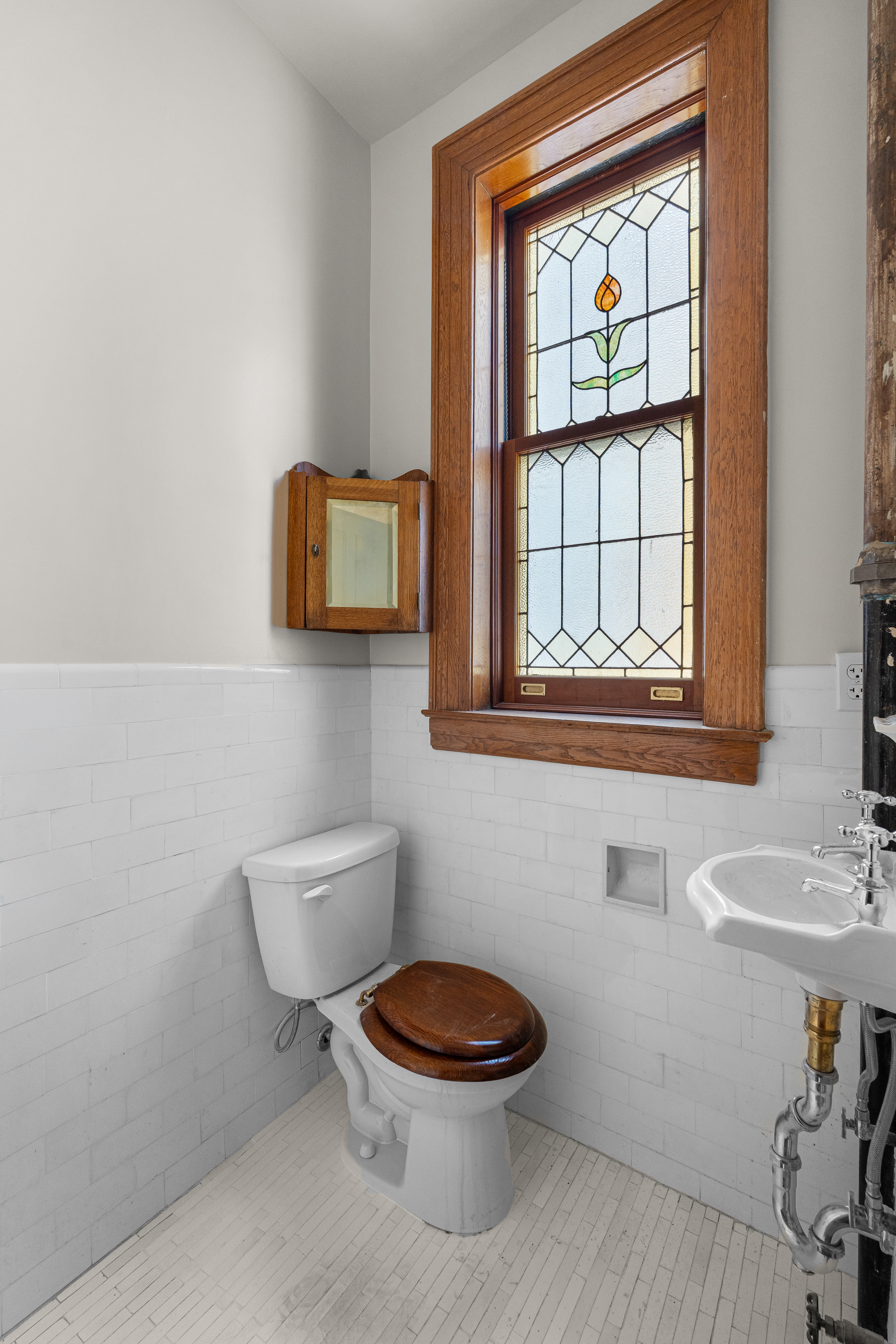 645 West End Avenue, Unit 11D Manhattan, NY 10025 - Photo 12 of 21 a bathroom with a toilet a sink and a mirror