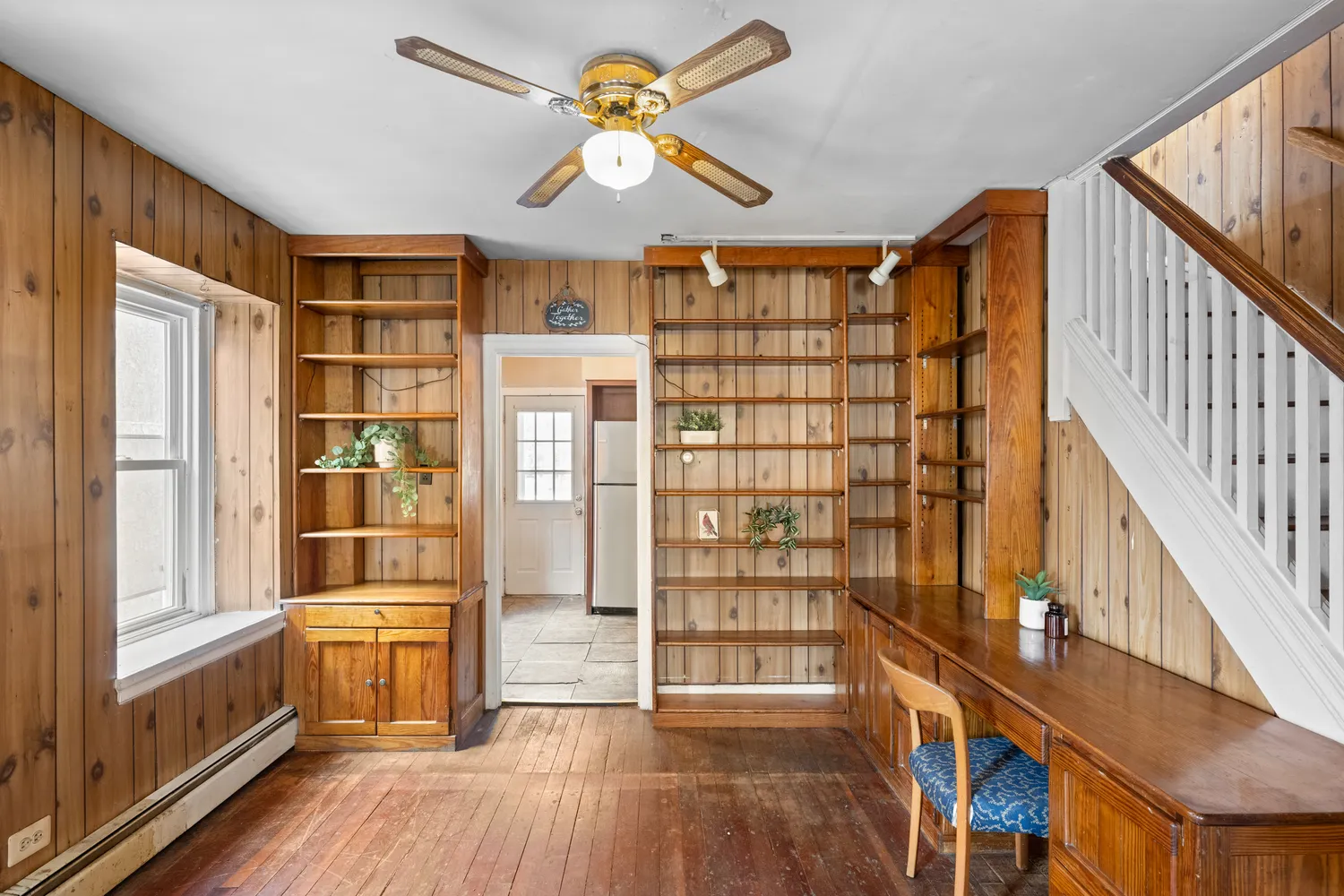 a view of an entryway with wooden floor