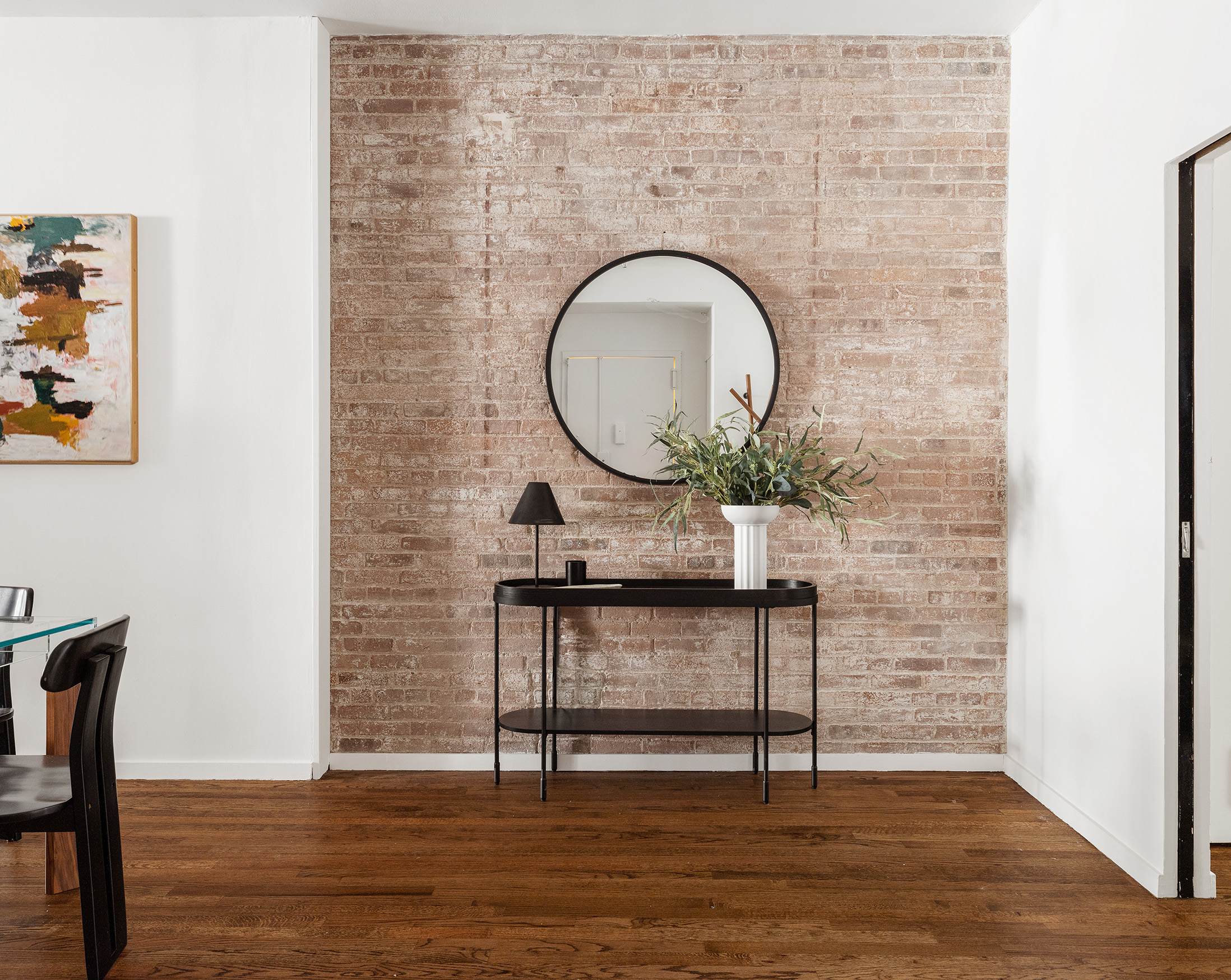 214 West 17th Street, Unit 4B Manhattan, NY 10011 - Photo 6 of 10 a living room with a table chairs and a wooden floor
