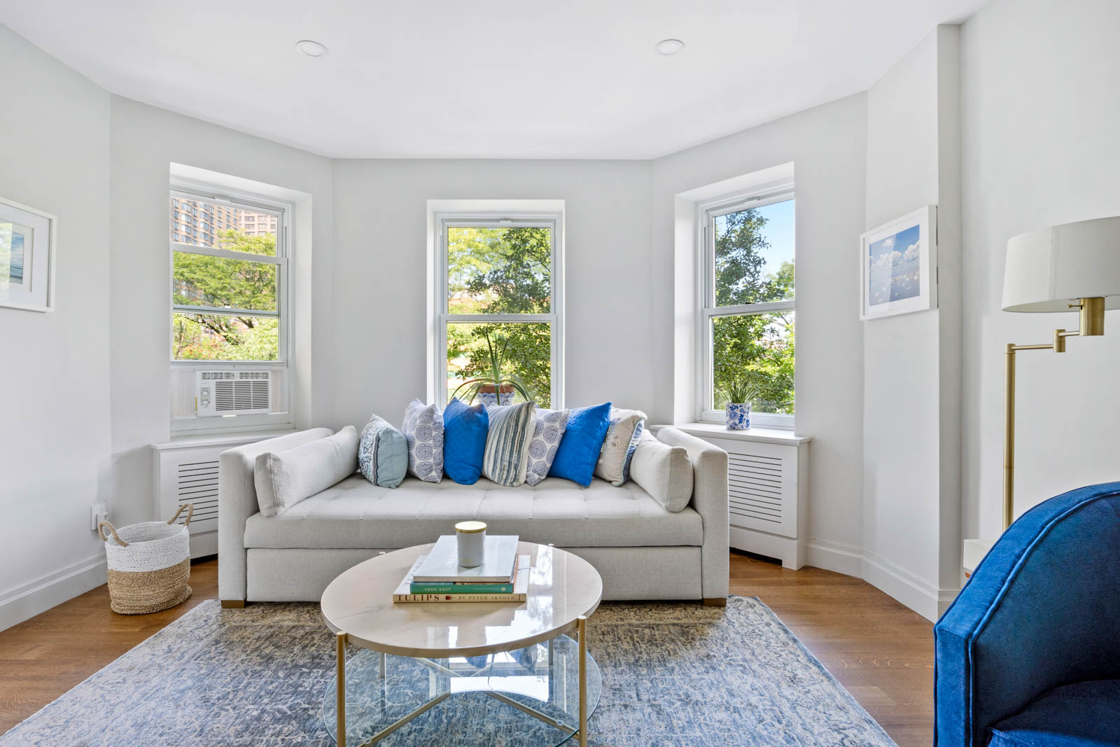520 East 90th Street, Unit 3M Manhattan, NY 10128 - Photo 2 of 11 a living room with furniture and a large window