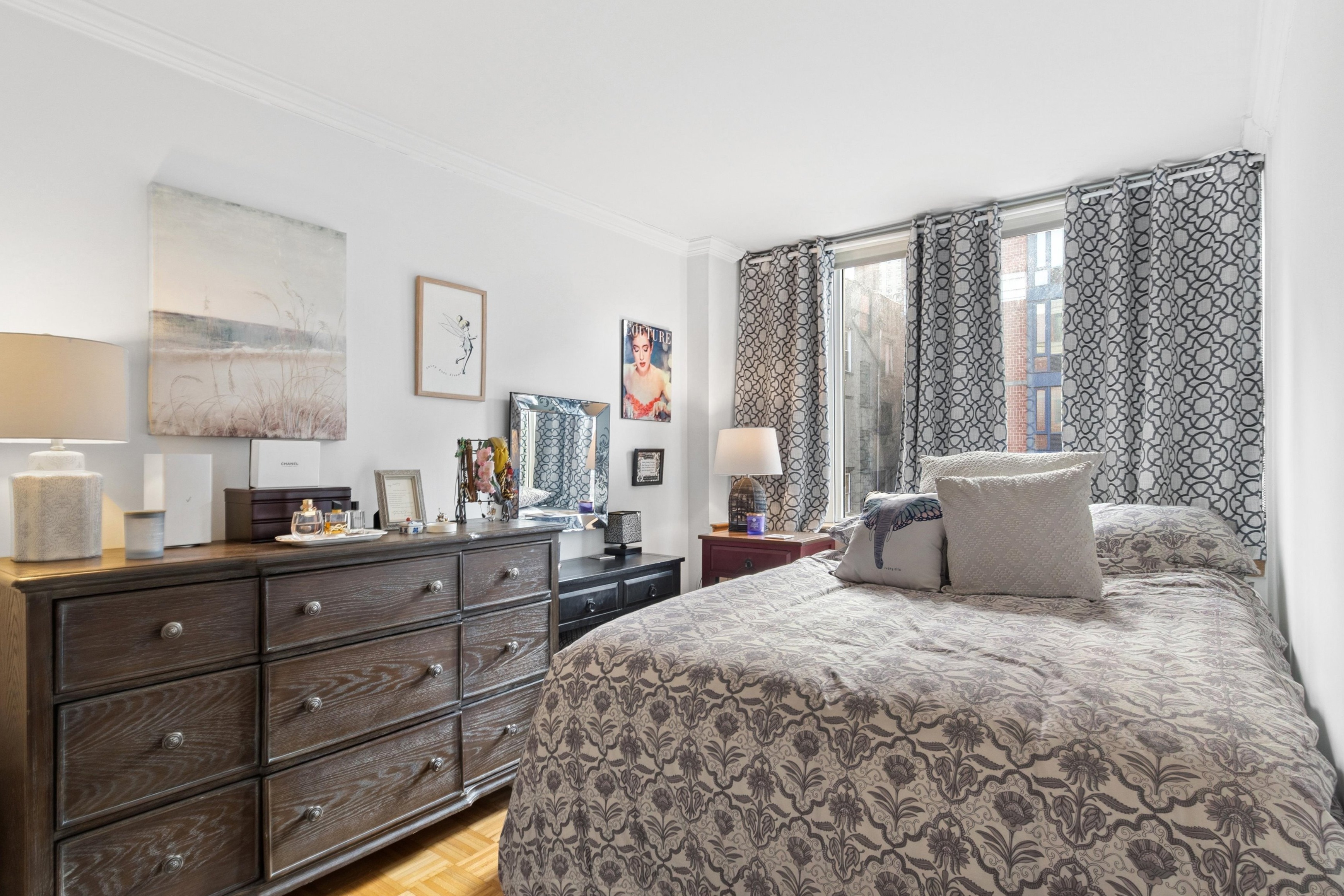 404 East 76th Street, Unit 4M Manhattan, NY 10021 - Photo 5 of 13 a bedroom with a large bed and a window
