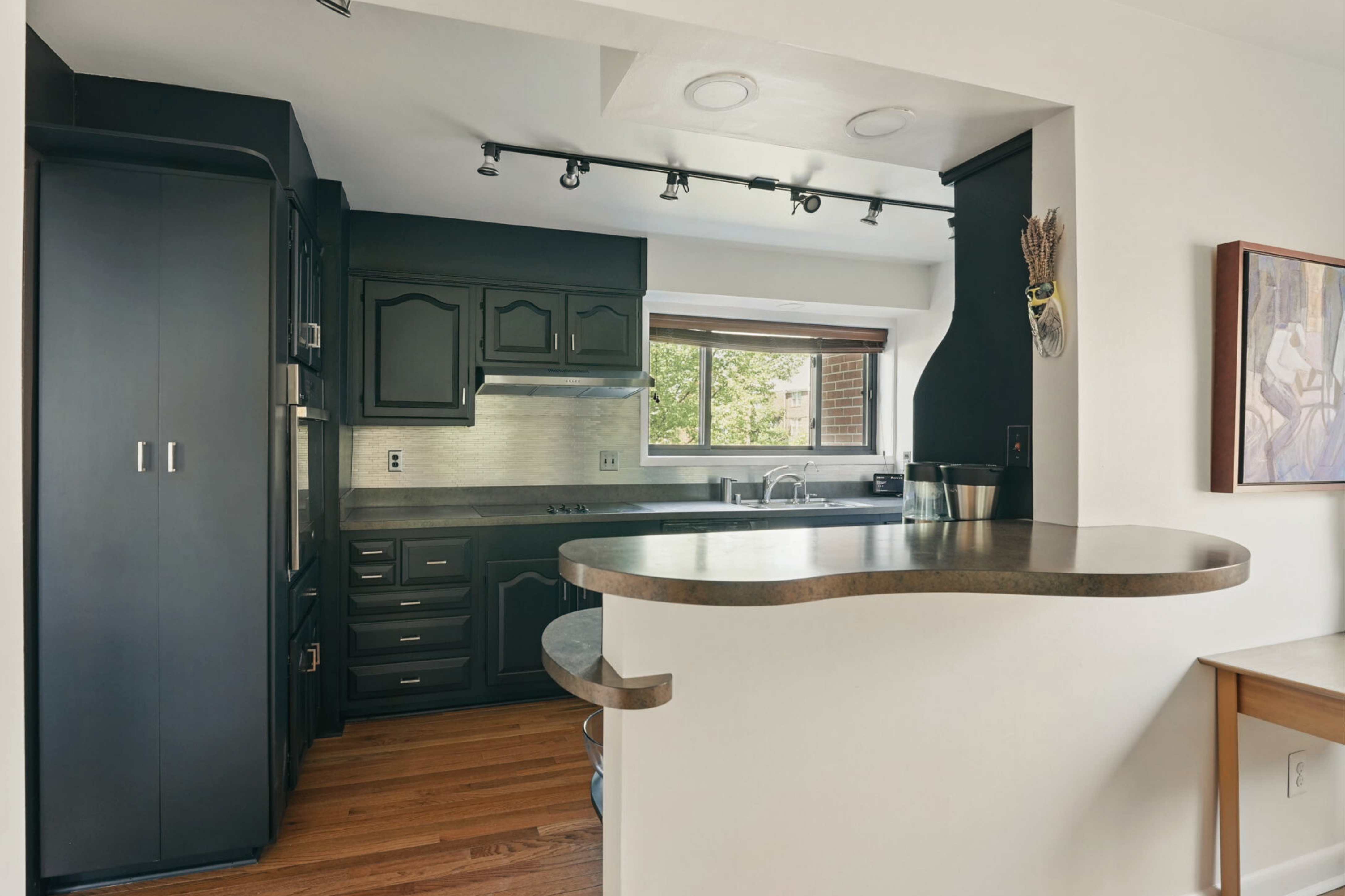 8003 16th Street Northwest Washington, DC 20012 - Photo 14 of 38 a kitchen with granite countertop a sink and a stove