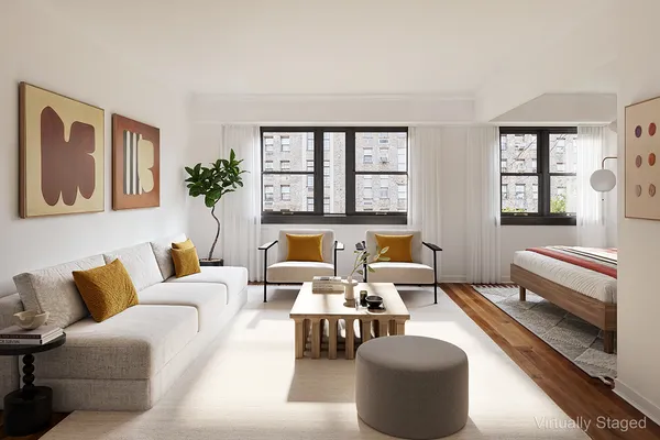 a living room with furniture and windows