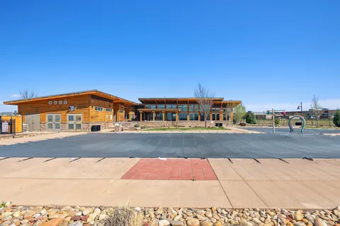an aerial view of a residential houses with outdoor space