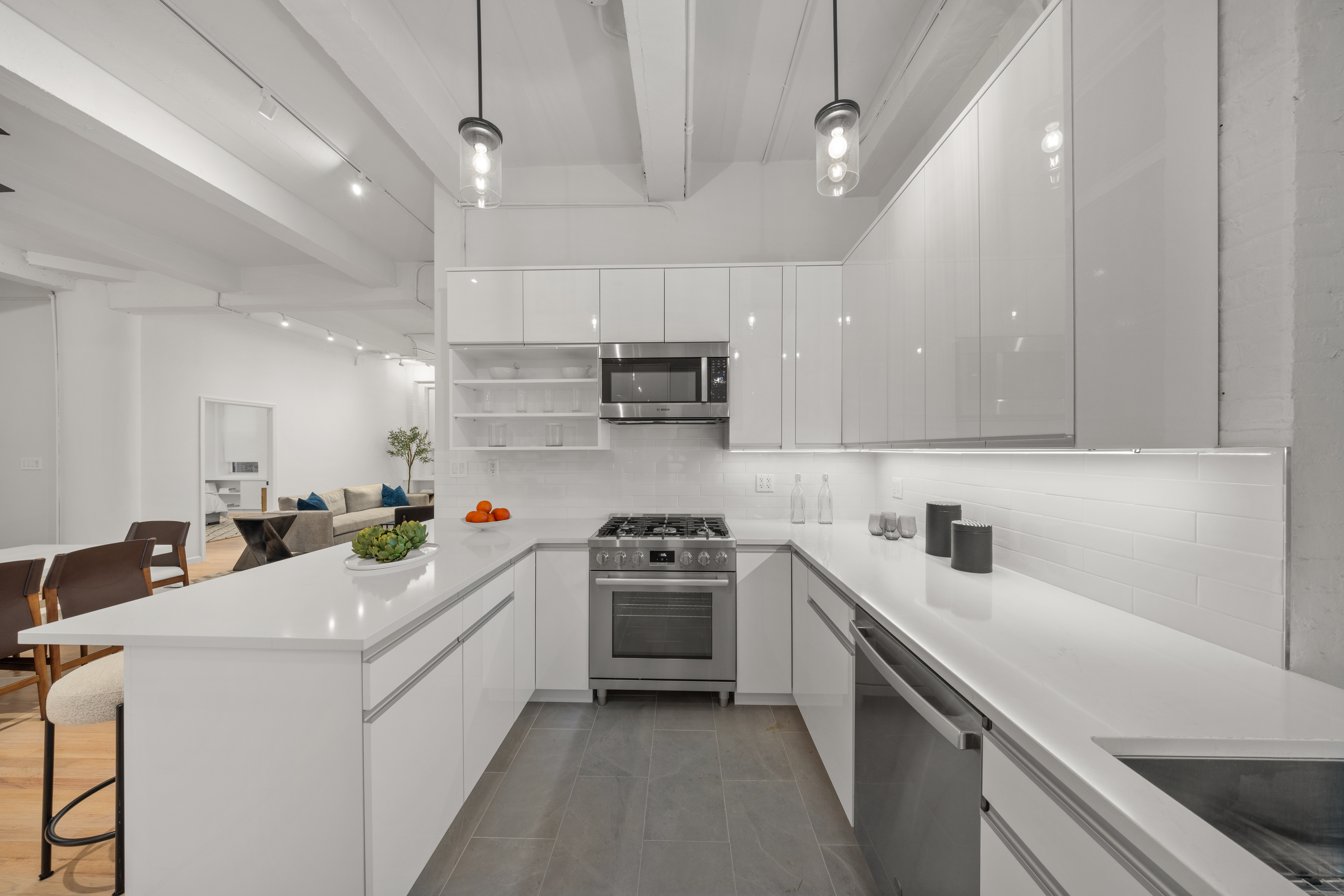 95 Vandam Street, Unit 2R Manhattan, NY 10013 - Photo 6 of 21 a kitchen with a sink a stove and cabinets